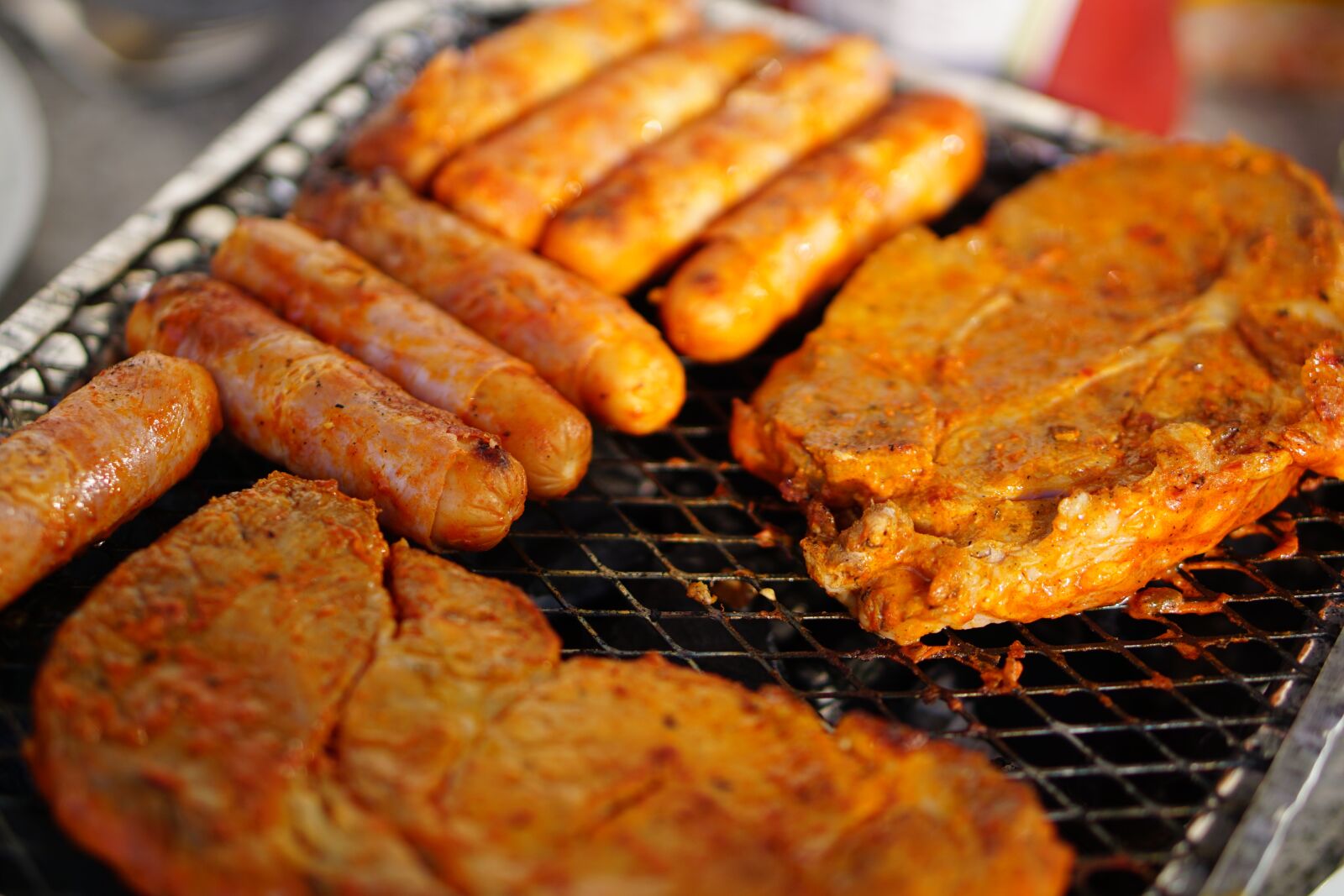 E 50mm F1.8 OSS sample photo. Meat, barbecue, eat photography