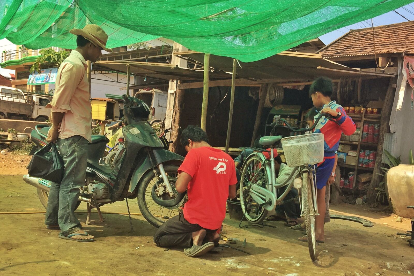 iPhone 6 Plus back camera 4.15mm f/2.2 sample photo. Bicycle, repairs, kratie photography