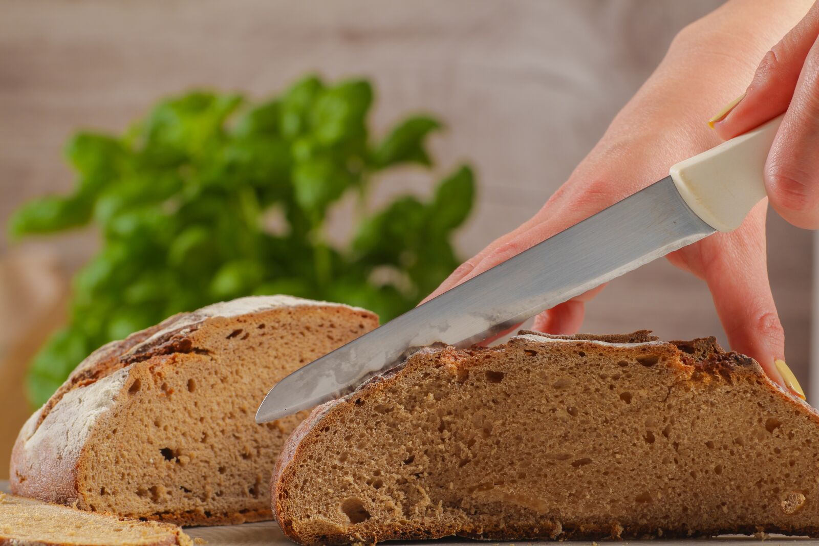 Canon EOS 7D + Canon EF 70-200mm F4L USM sample photo. Bread cutting, bread, knife photography