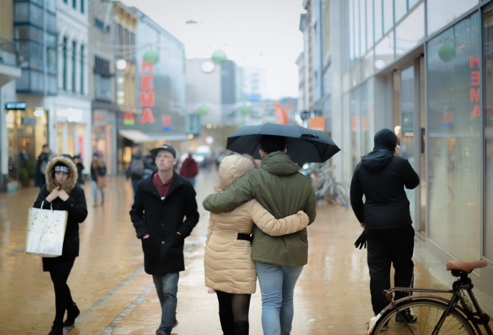Nikon D610 sample photo. Rain, umbrella, people photography