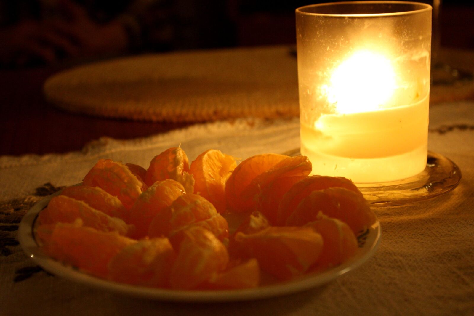 f/3.5-5.6 IS sample photo. Clementine, fruit, glass, candle photography
