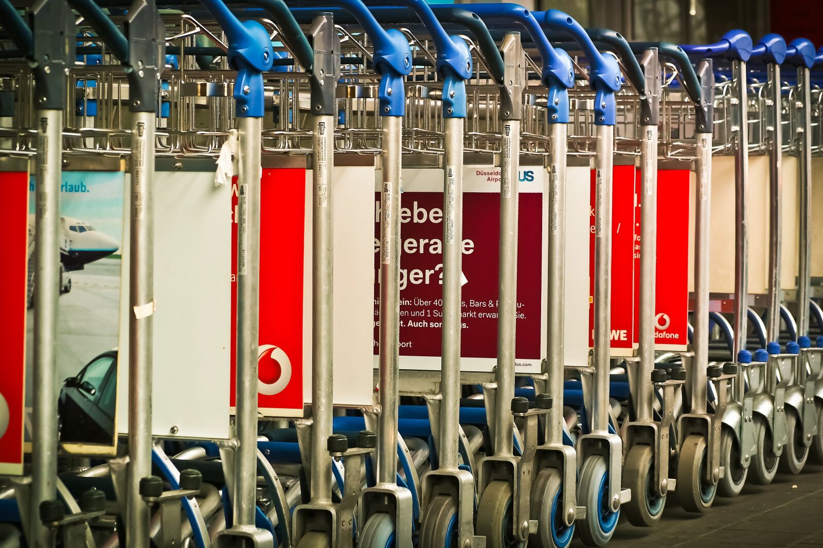 Olympus OM-D E-M10 sample photo. Airport, baggage car, transport photography