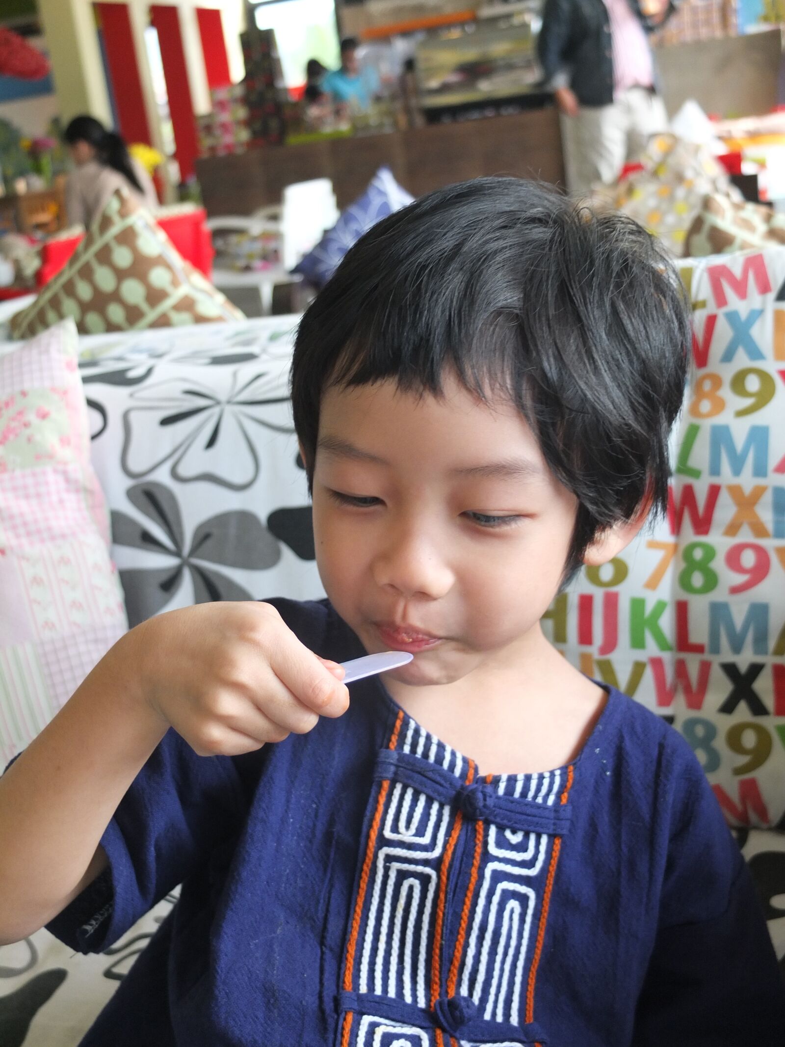 Fujifilm X10 sample photo. Boy, eat food, happiness photography