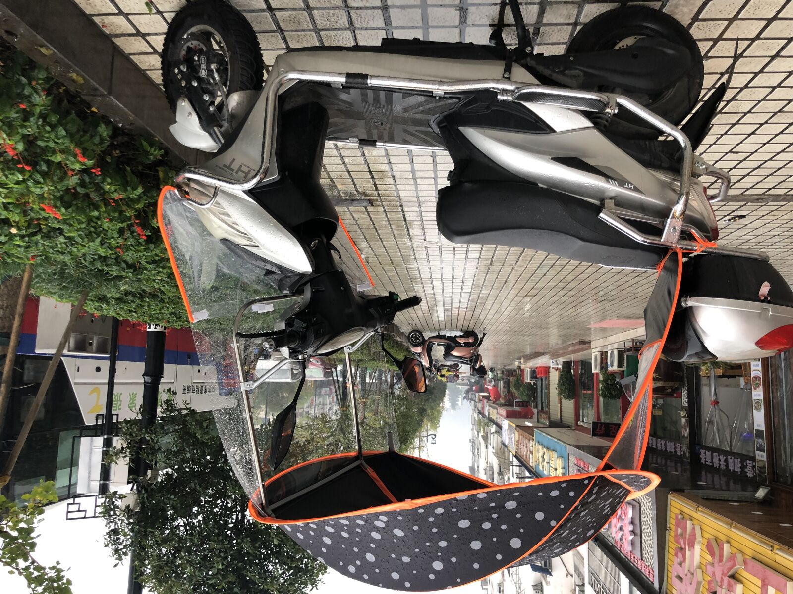 iPhone X back dual camera 4mm f/1.8 sample photo. Moped, motorcycle, protection, rain photography