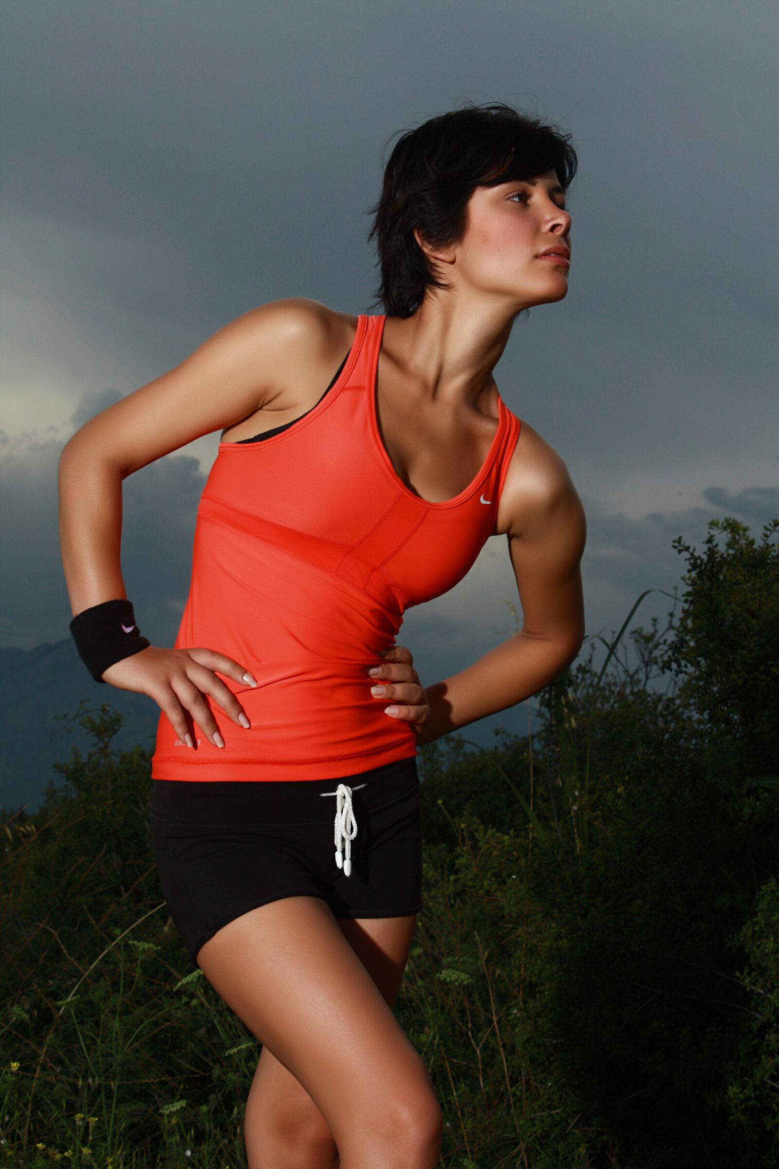 Canon EOS 450D (EOS Rebel XSi / EOS Kiss X2) sample photo. Orange, woman, sports photography