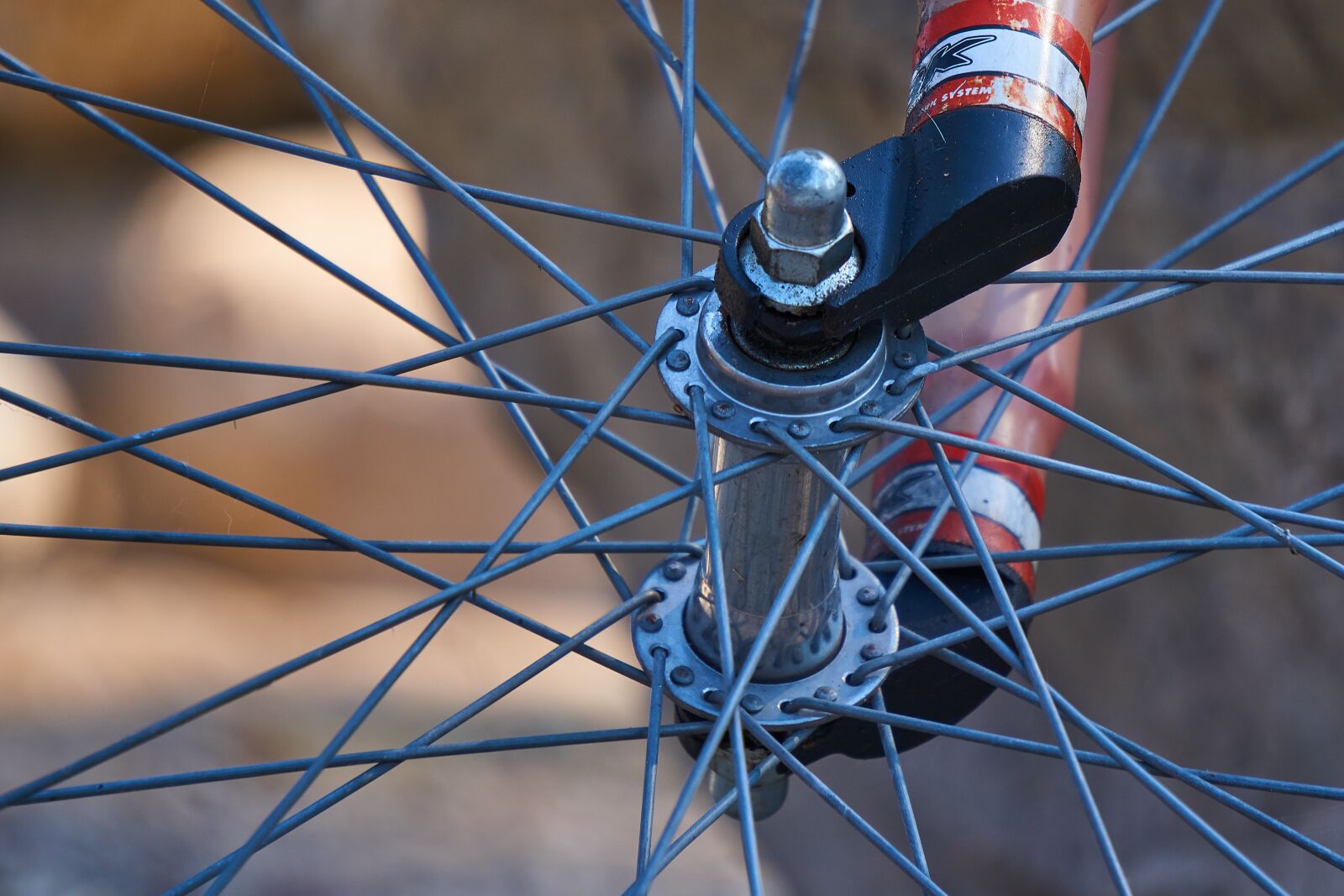 Sony E 55-210mm F4.5-6.3 OSS sample photo. Bicycle tires, rim, spokes photography