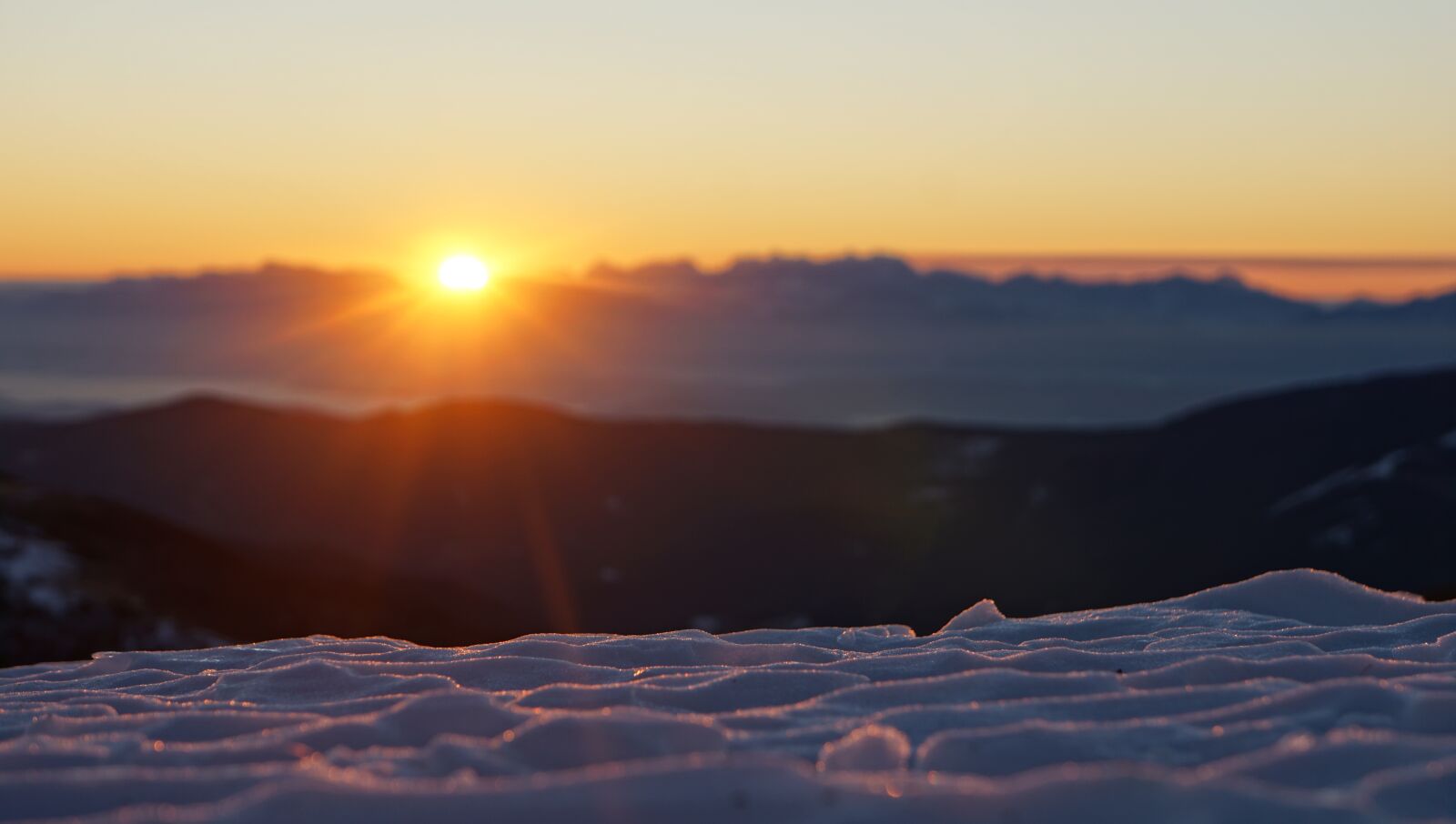 Sony a6000 + Sony E 18-55mm F3.5-5.6 OSS sample photo. Sunrise, mountain, snow photography