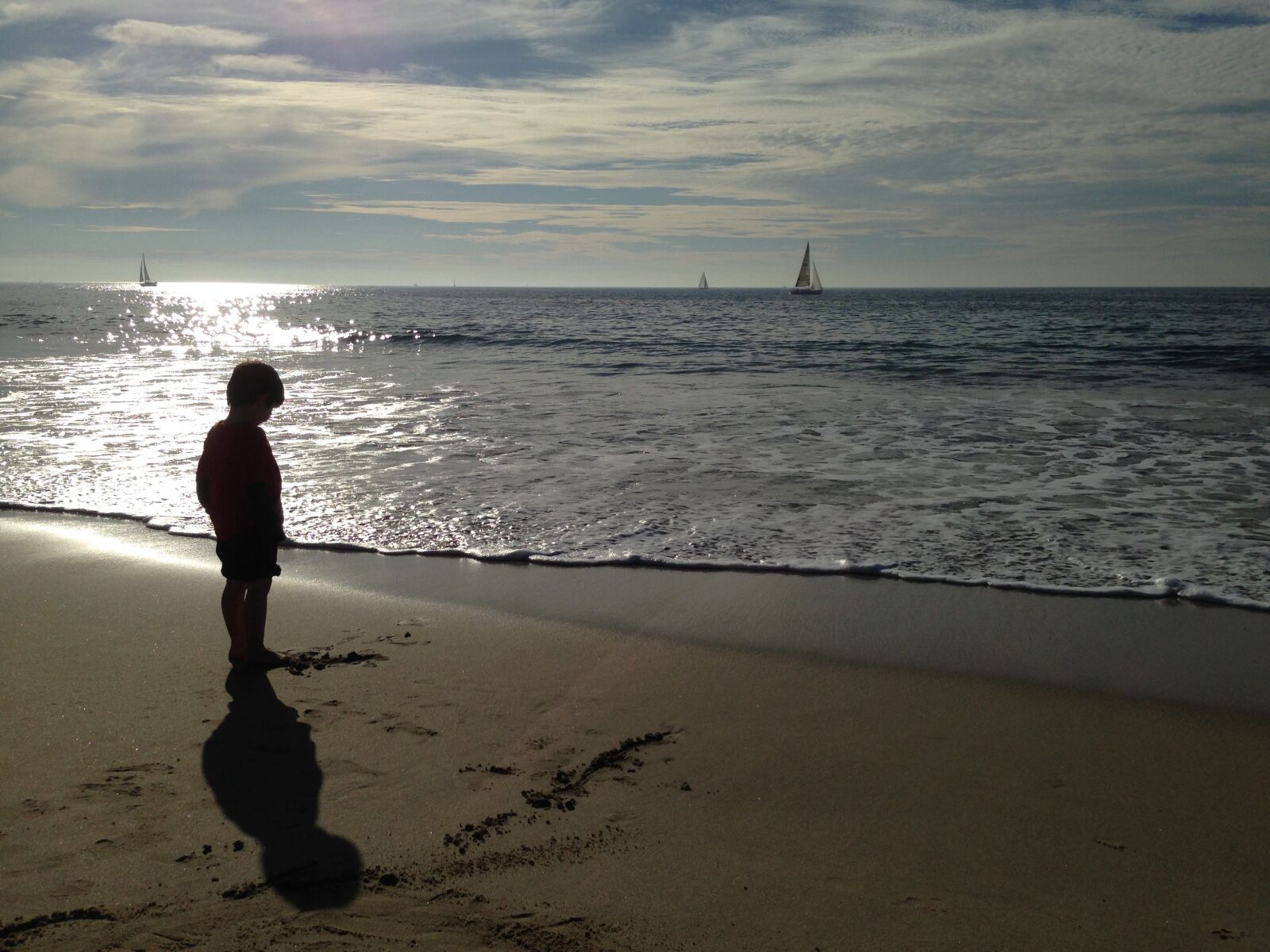 iPhone 5 back camera 4.12mm f/2.4 sample photo. Beach, sailboat, boy photography