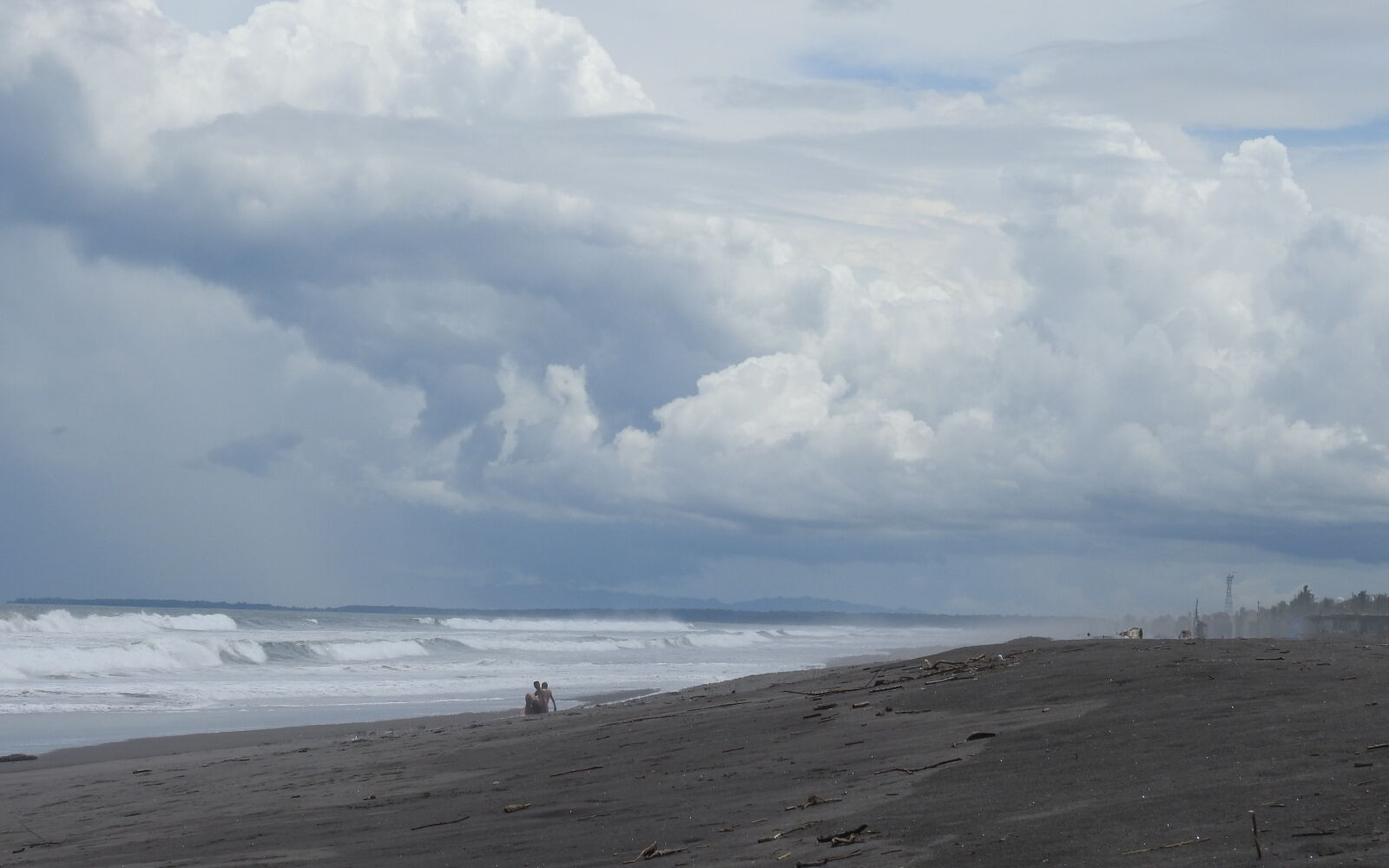 Nikon Coolpix P900 sample photo. Beach, couple, sitting, sea photography