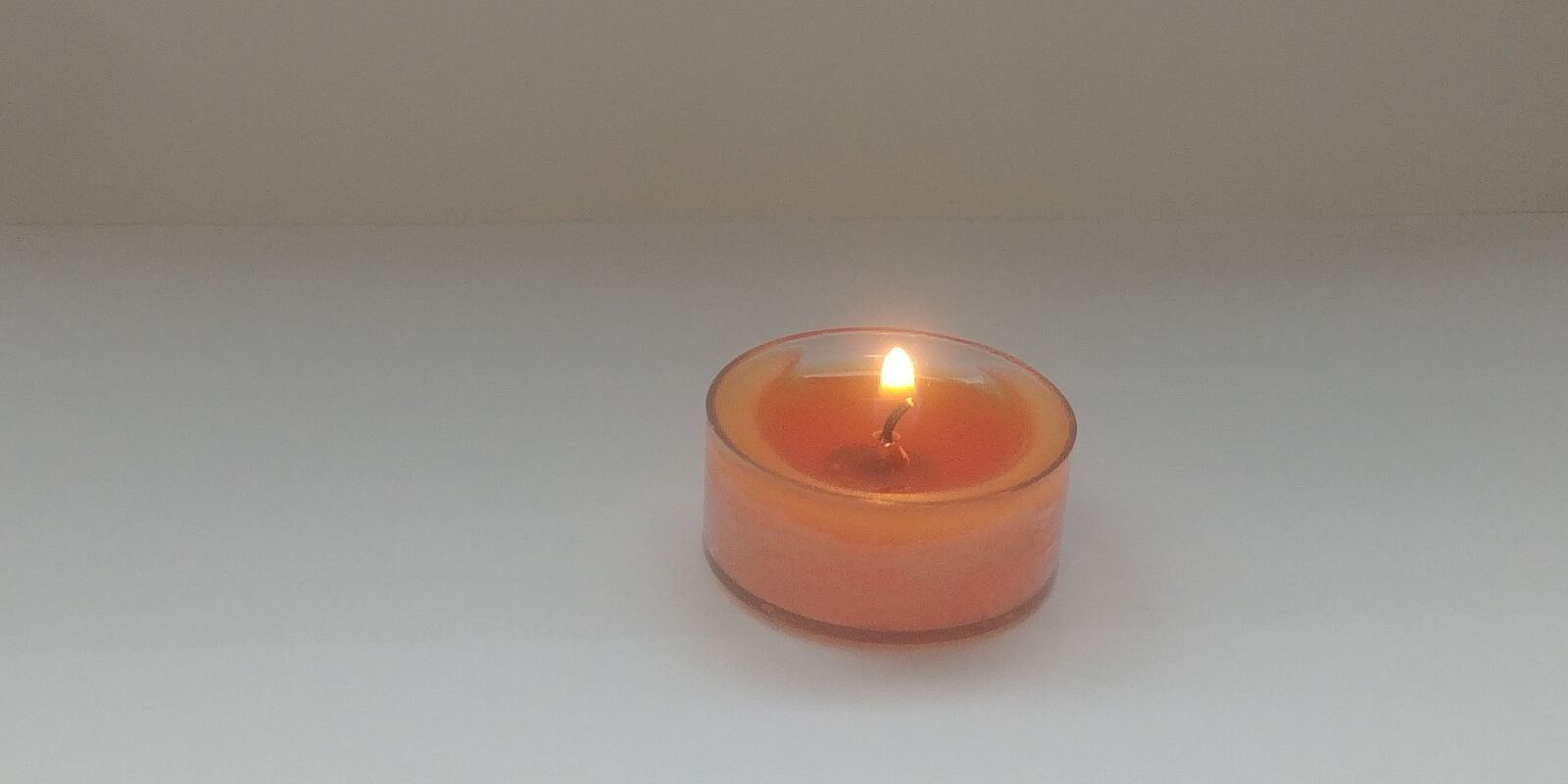 LG G6 sample photo. Candle, melt, orange photography