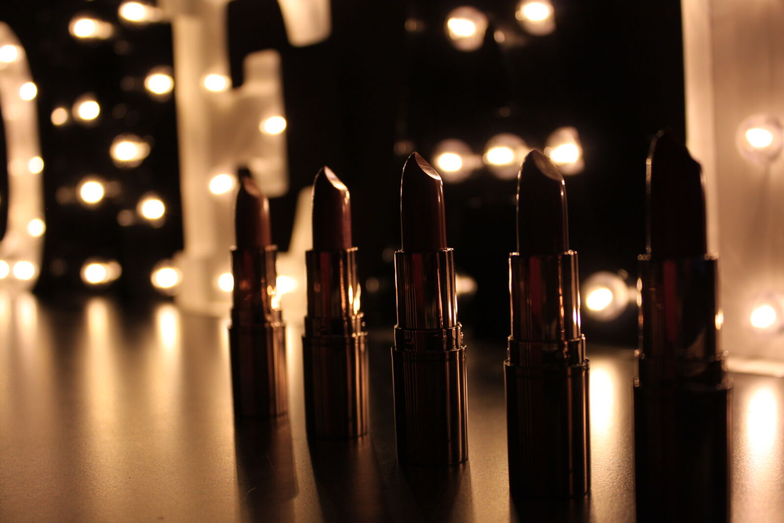 Canon EF-S 18-55mm F3.5-5.6 IS sample photo. Lights, lipstick, makeup, dark photography