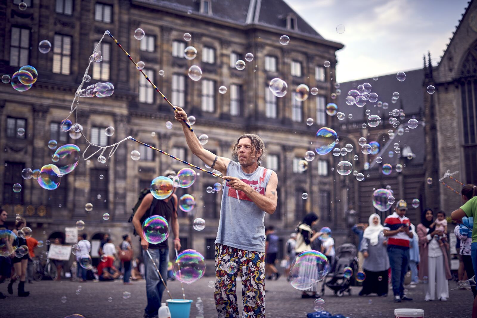 Nikon AF-S Nikkor 50mm F1.4G sample photo. Bubbles, a man, square photography