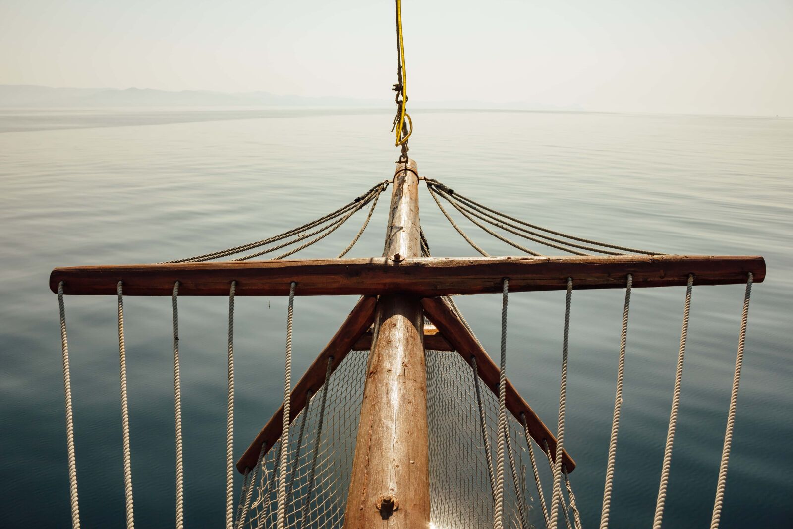 Canon EF-S 18-55mm F3.5-5.6 IS sample photo. Calm, sailboat, ocean, sunshine photography