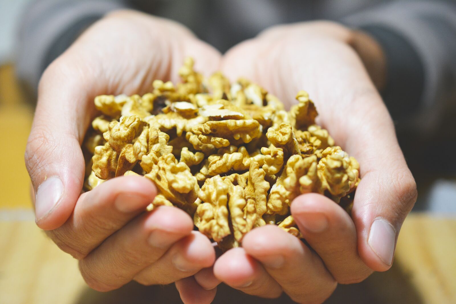 Nikon D5200 sample photo. Nuts, hands, detail photography