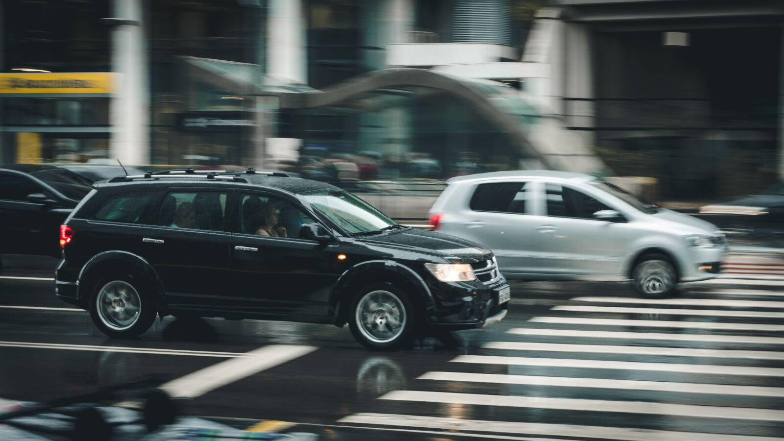 Sony a6300 sample photo. Black, suv, beside, grey photography