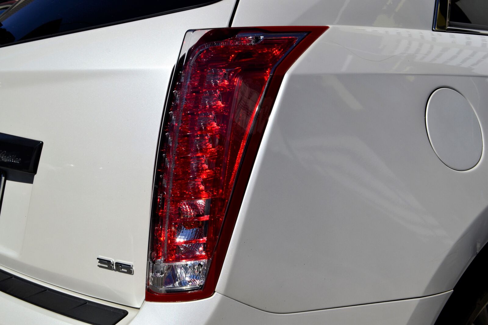 Nikon D3100 sample photo. Cadillac, break light, hatchback photography