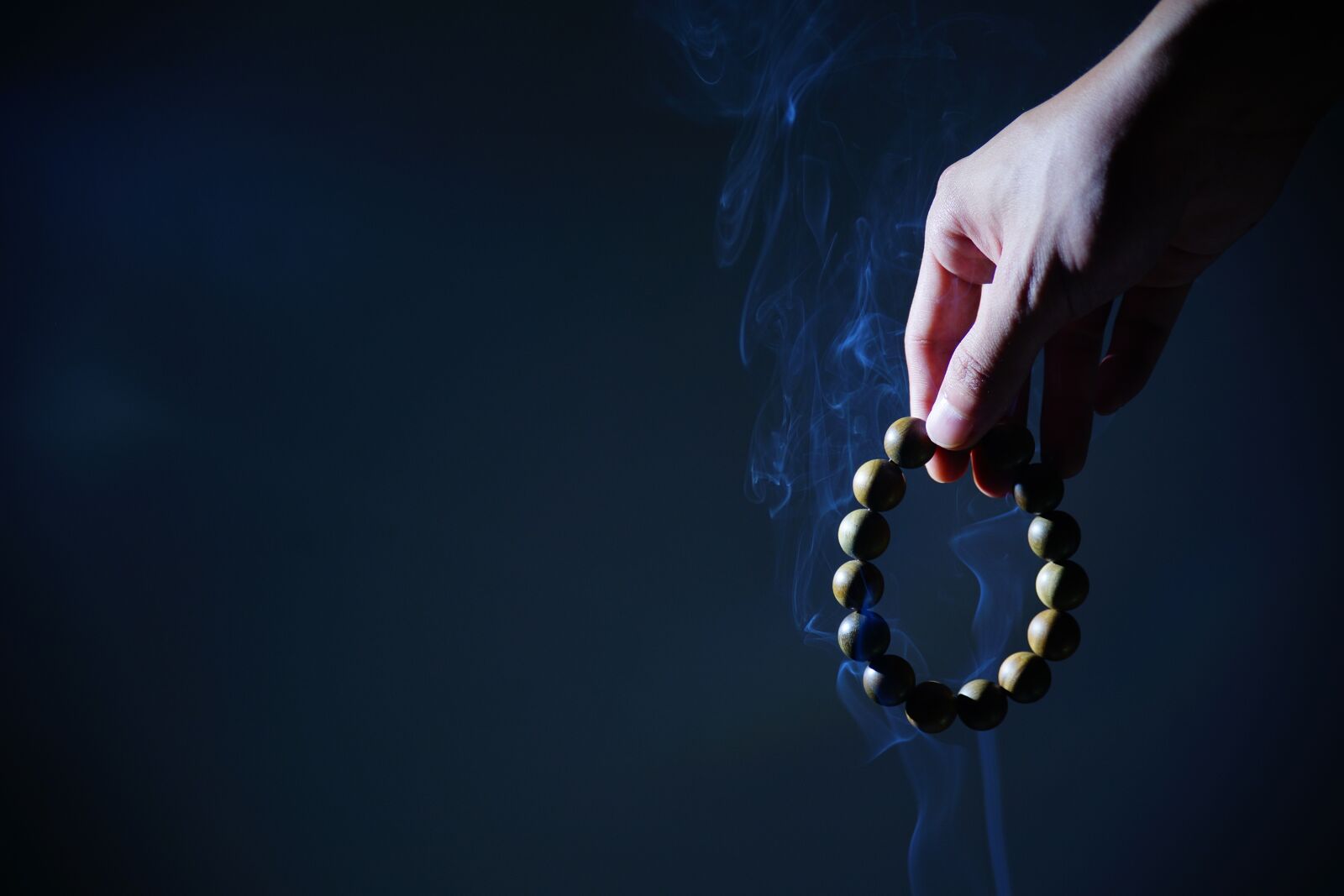 Sony a99 II sample photo. Hand, buddhist prayer beads photography