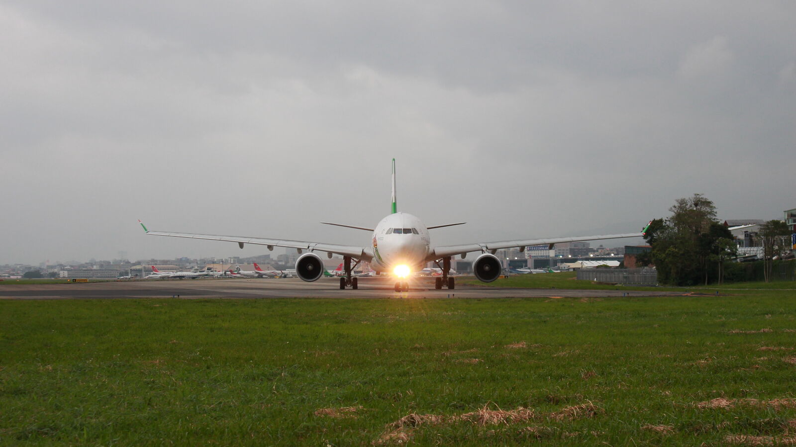 Canon EOS M sample photo. Airplane, on, runway, against photography