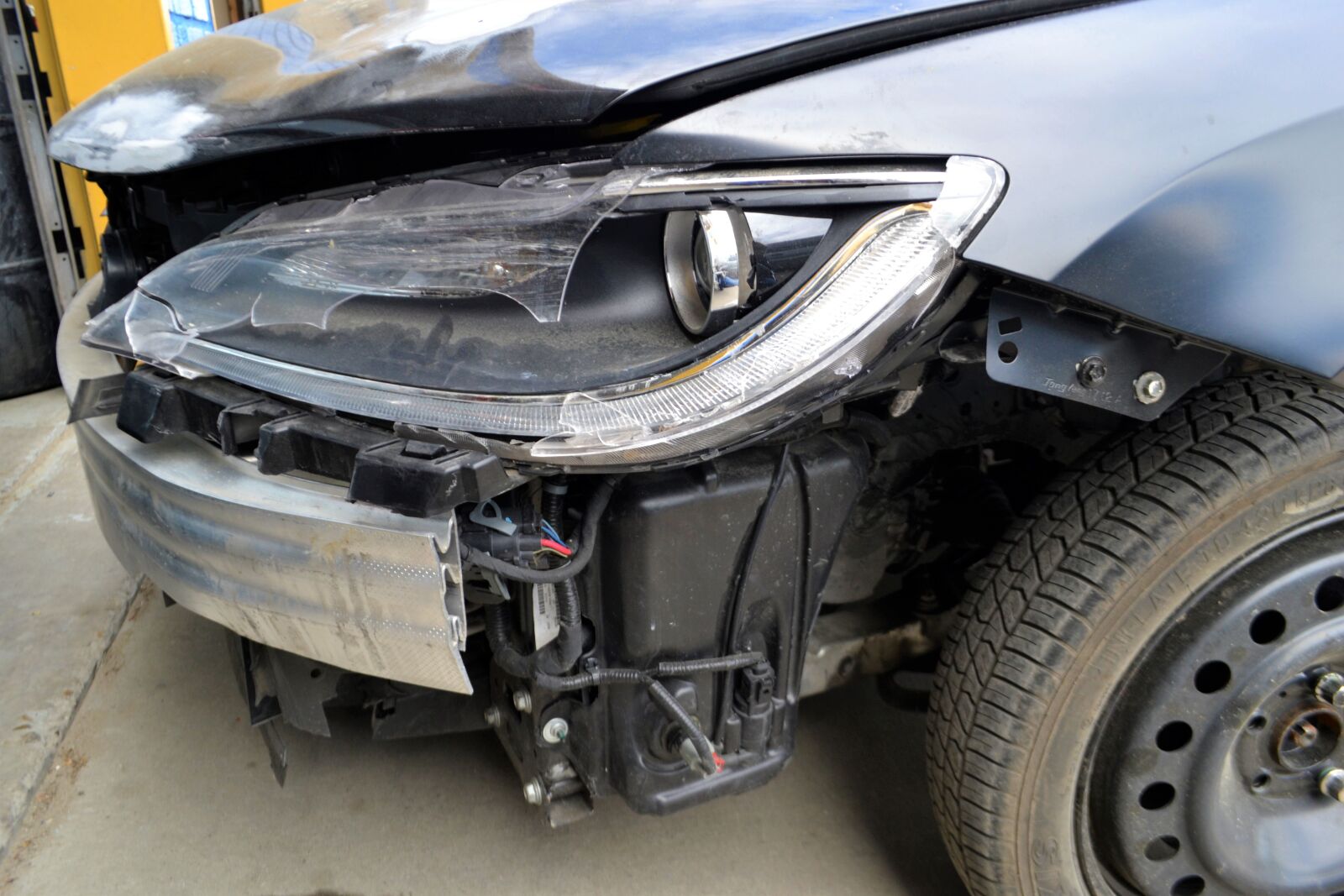 Nikon D3100 sample photo. Auto repair shop, broken photography