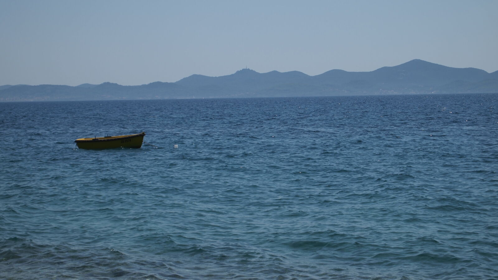 Olympus M.Zuiko Digital ED 14-42mm F3.5-5.6 L sample photo. Blue, boat, coast, mountains photography