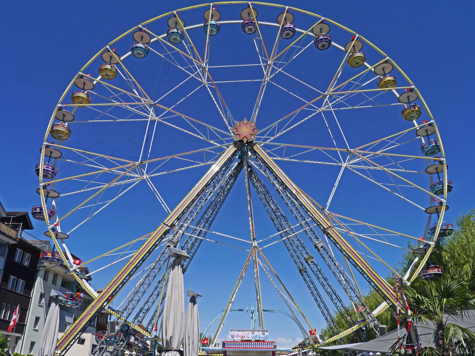 Panasonic Lumix DMC-G3 sample photo. Amusement park, wheel, city photography
