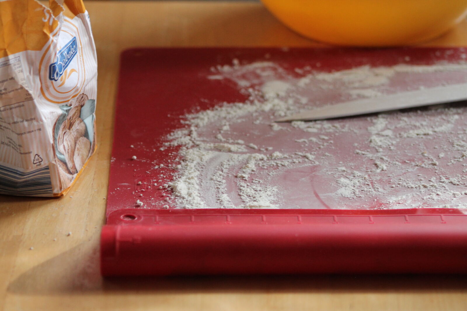 Canon EF 75-300mm f/4-5.6 sample photo. Cooking, flour, knife, red photography