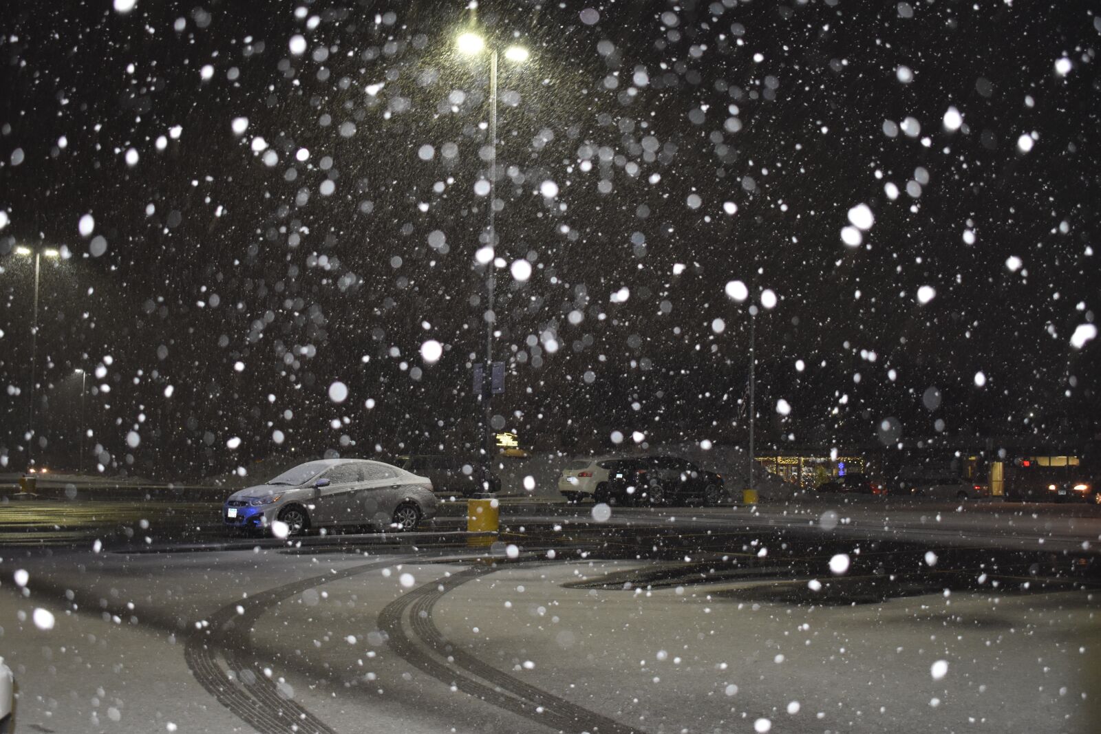 Nikon D3500 sample photo. Parking lot, snow, streetlights photography
