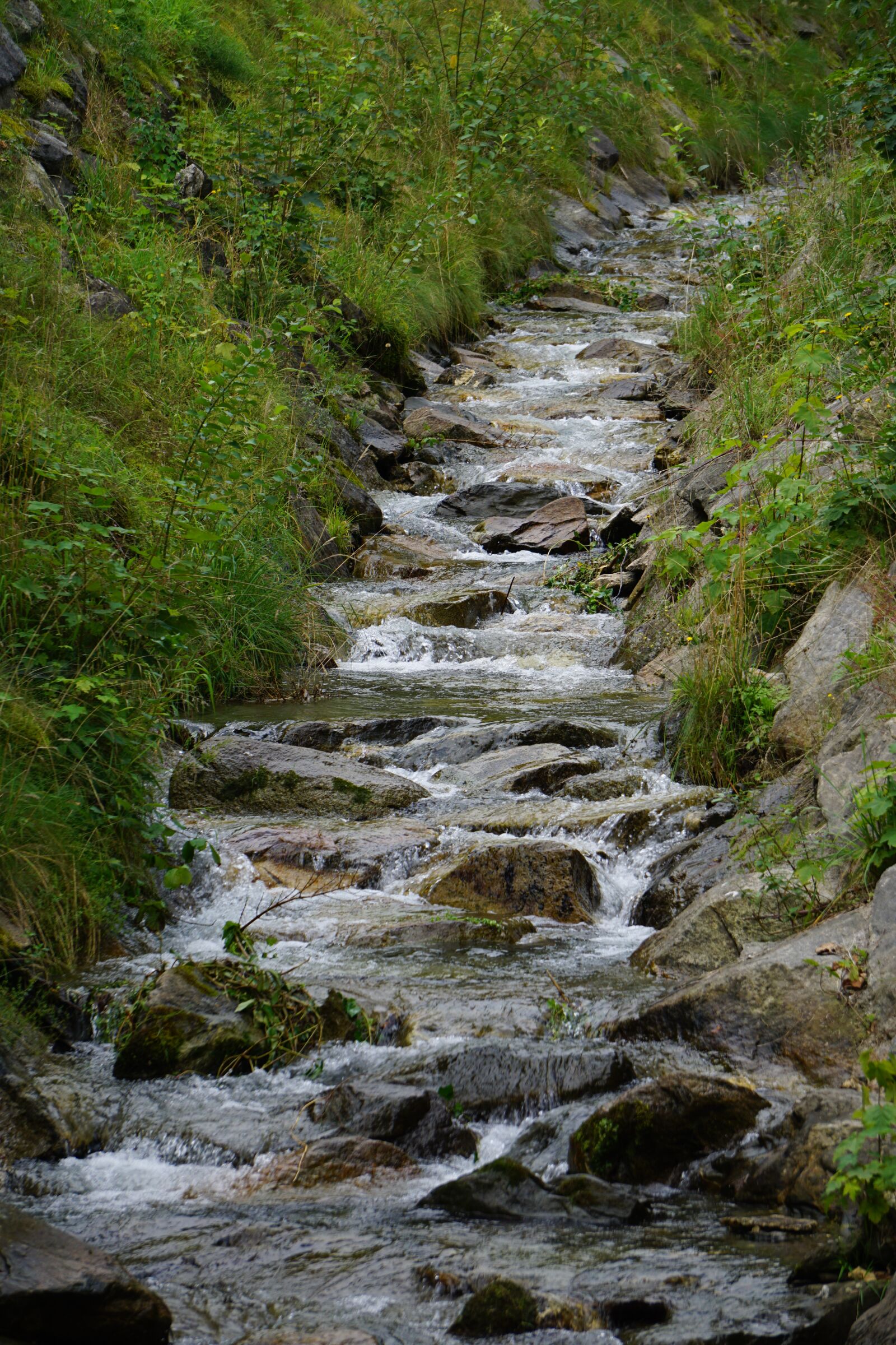 Sony E 55-210mm F4.5-6.3 OSS sample photo. Bach, mountains, landscape photography