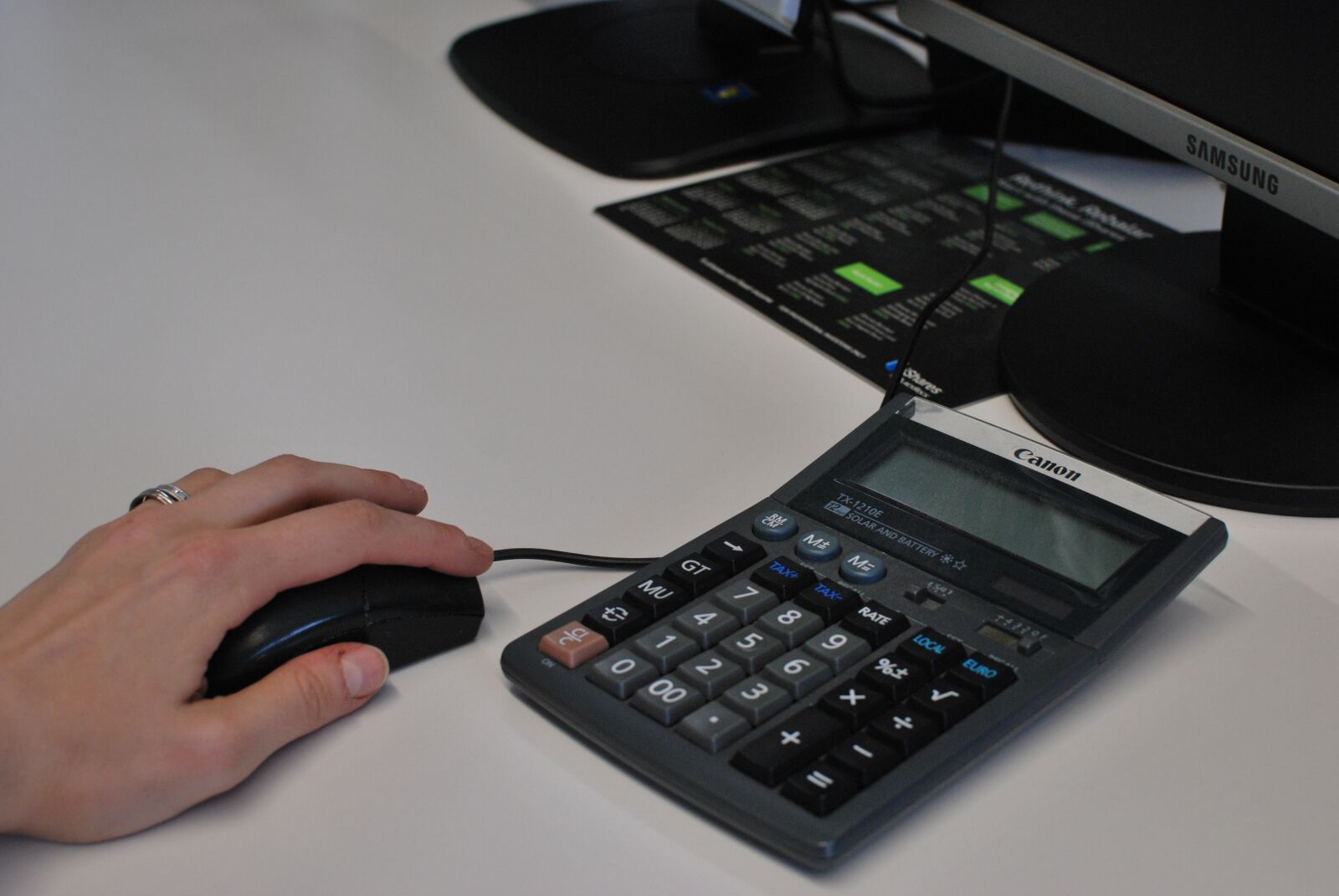 Nikon D60 sample photo. Calculator, mouse, hand photography