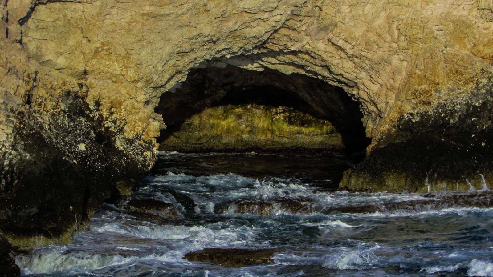 Canon PowerShot SX400 IS sample photo. Sea cave, waves, rocky photography
