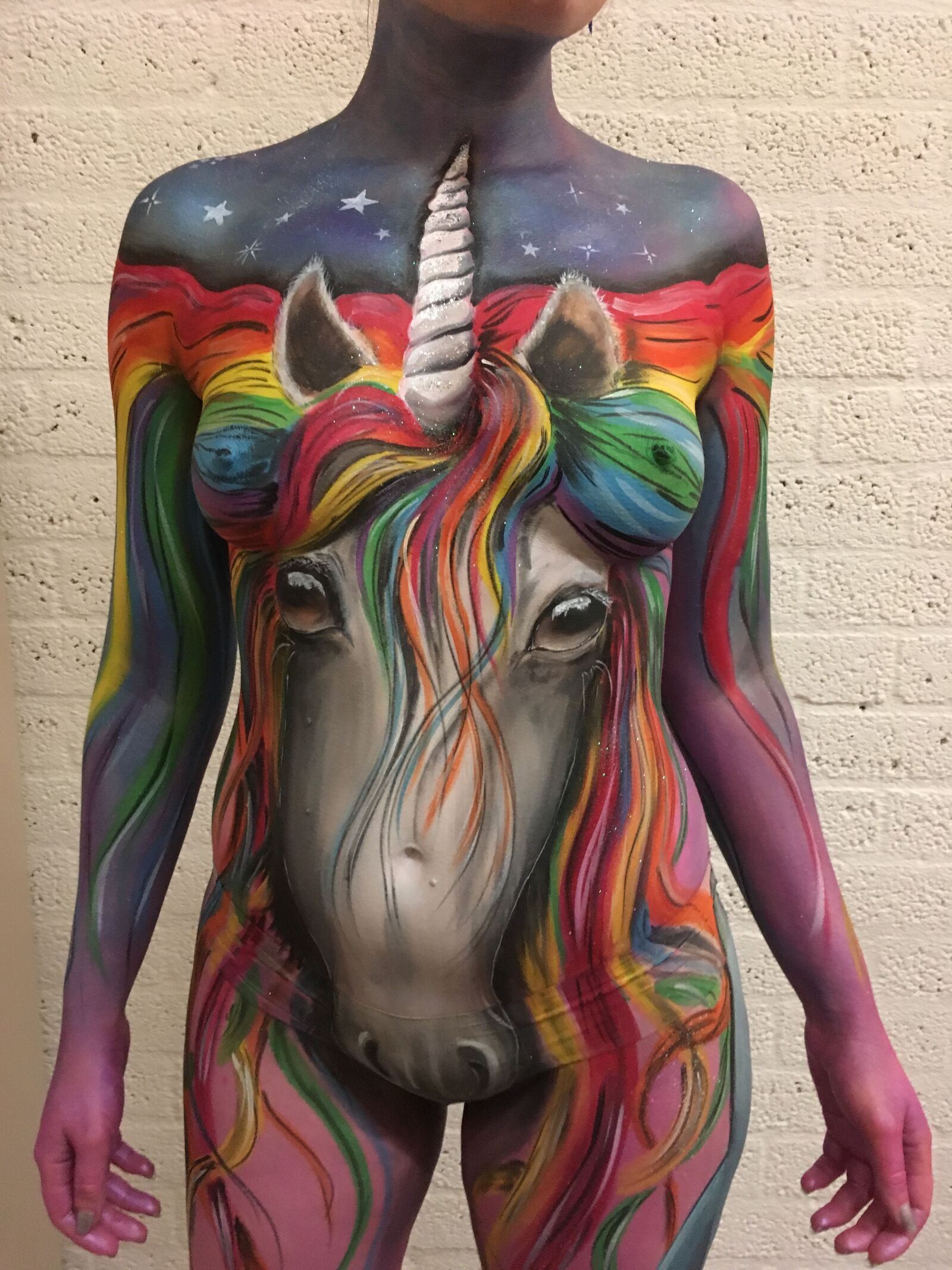 iPhone SE back camera 4.15mm f/2.2 sample photo. Bodypaint, bright, colours, unicorn photography