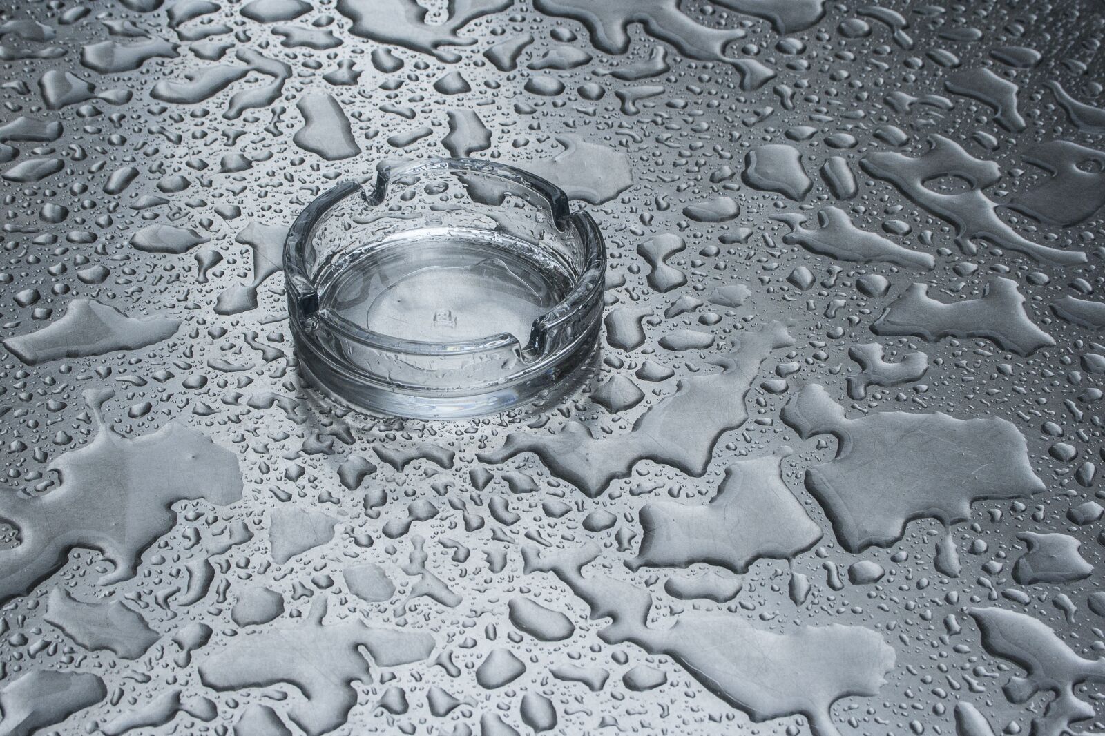 Canon EF-S 18-55mm F3.5-5.6 II sample photo. Table, drop of water photography