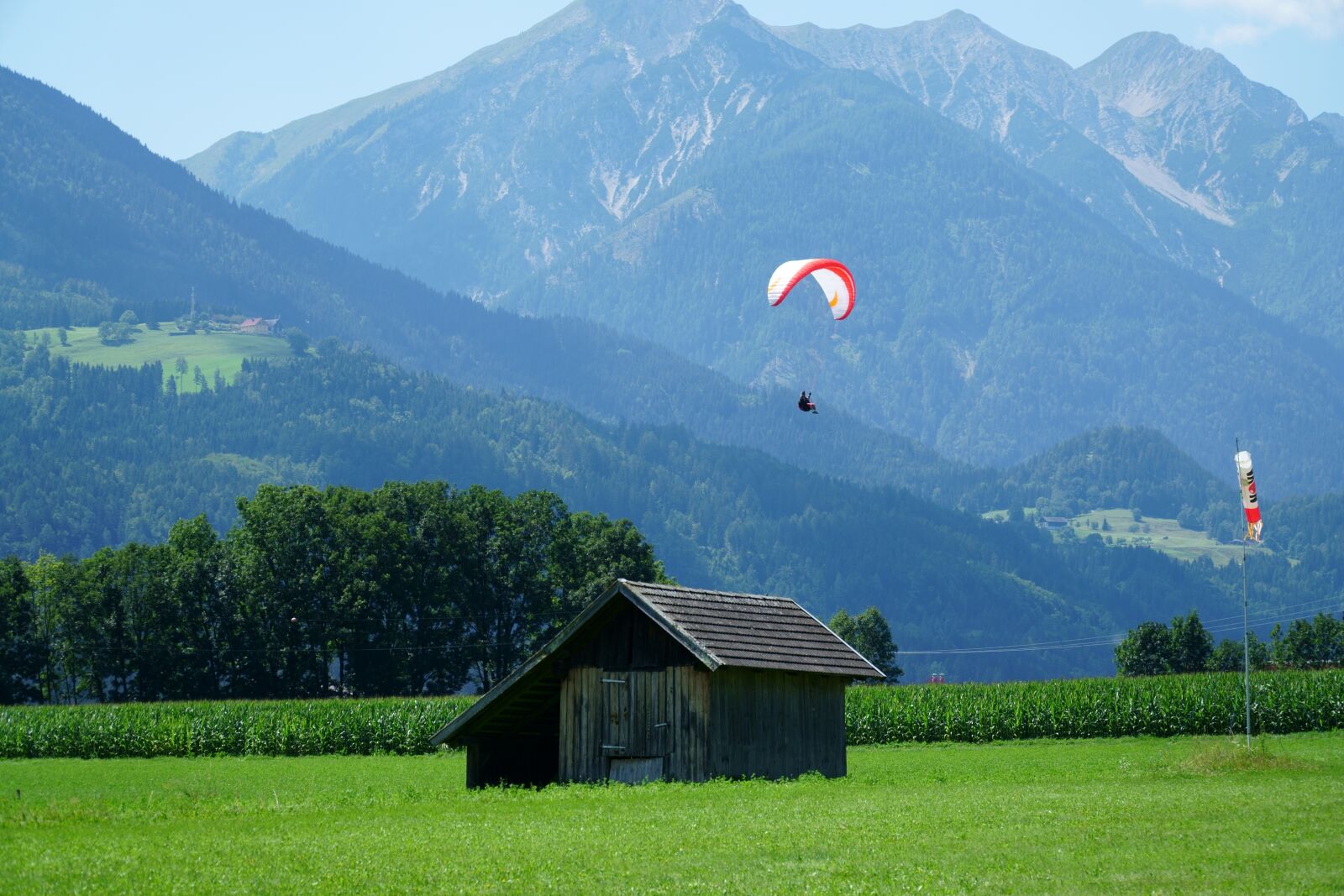 Sony E PZ 18-105mm F4 G OSS sample photo. Paragliding, flying, mountains photography