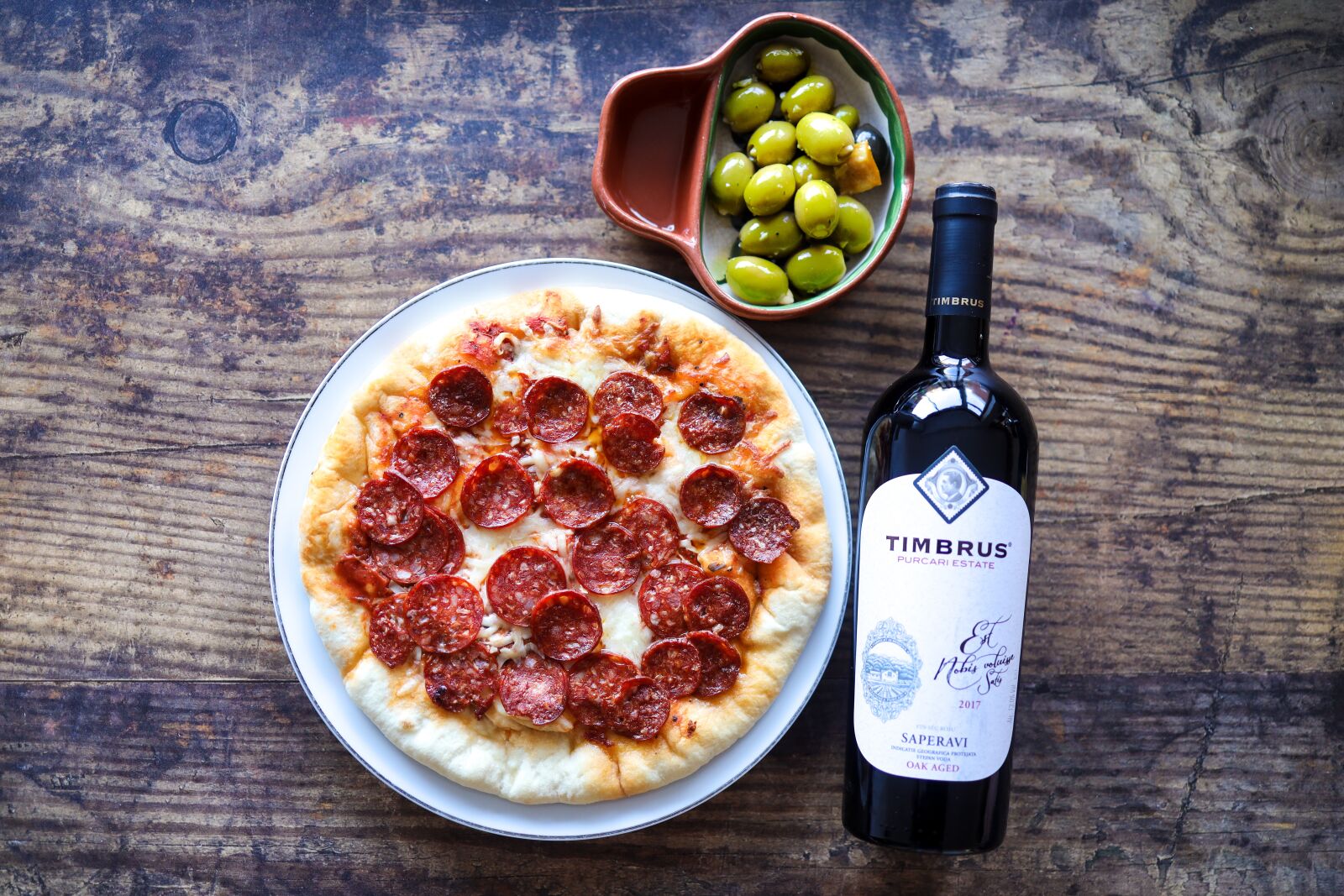 Canon RF 35mm F1.8 IS STM Macro sample photo. Pizza, wine, olives photography