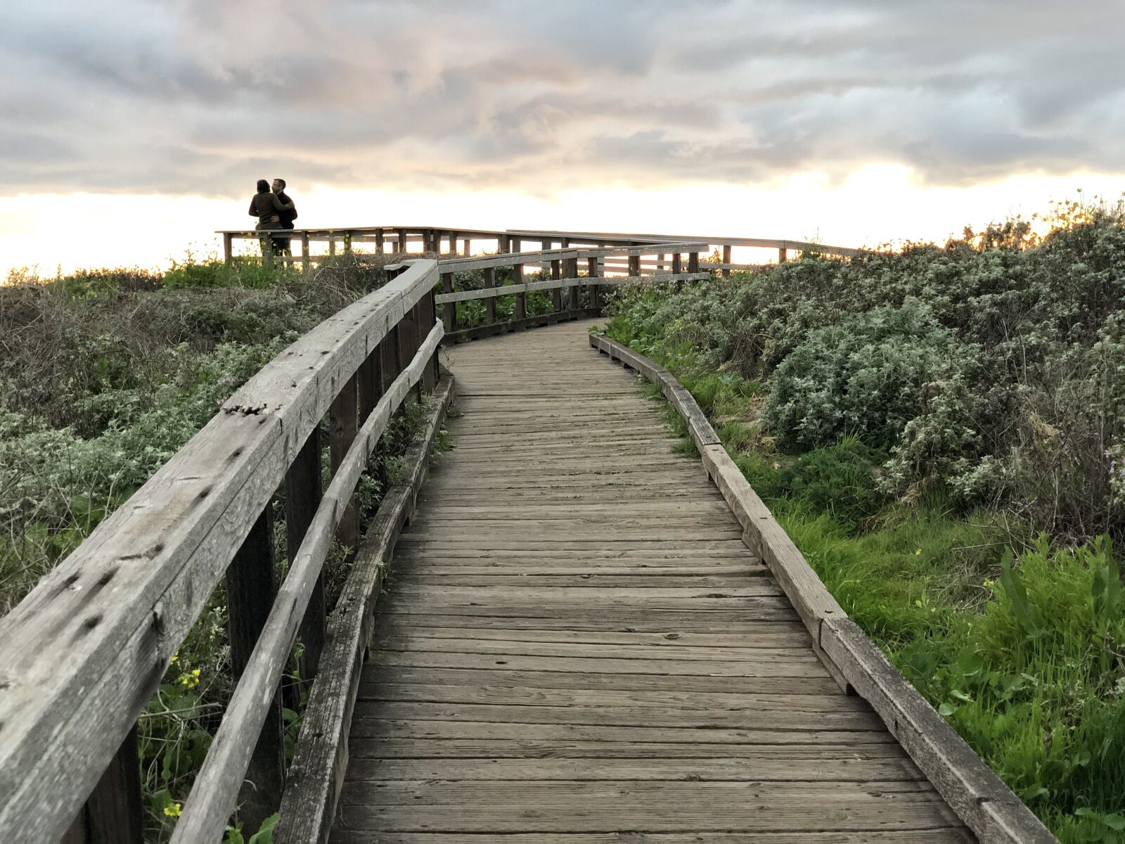 iPhone X back dual camera 6mm f/2.4 sample photo. Walkway, hug, silhouette photography