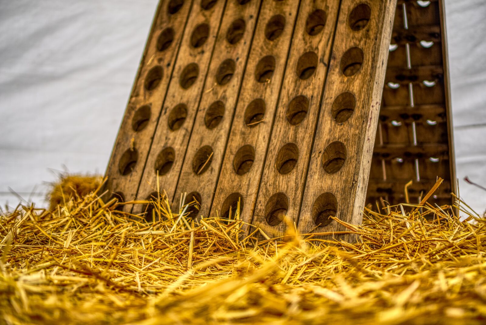Sony a6000 + Sony E 35mm F1.8 OSS sample photo. Wine rack, wood, straw photography