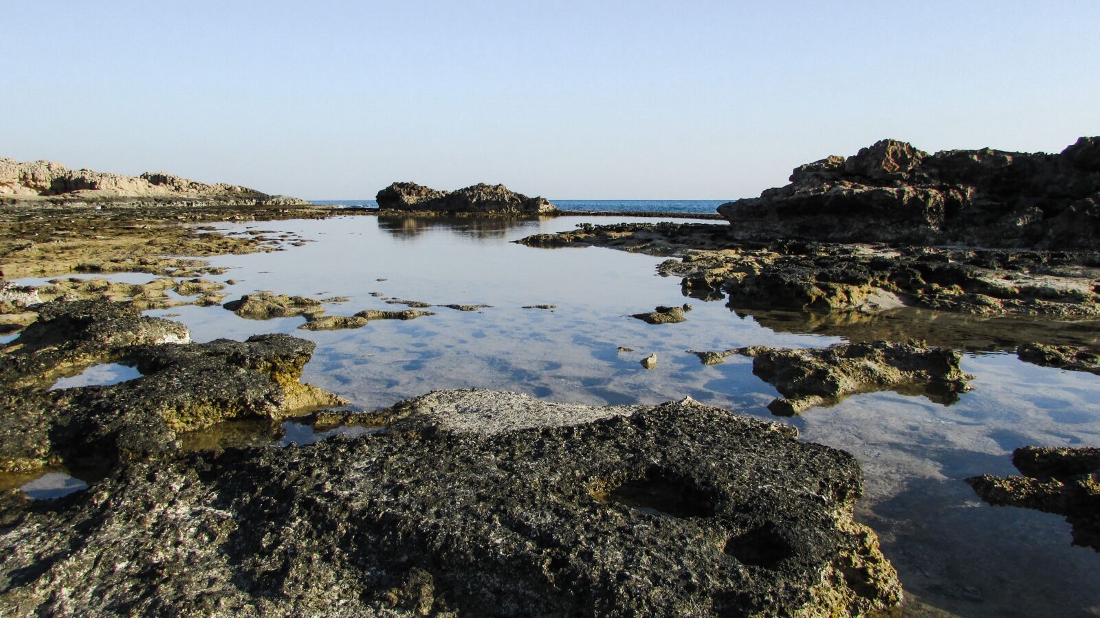 Canon PowerShot SX400 IS sample photo. Rocky coast, lagoon, blue photography