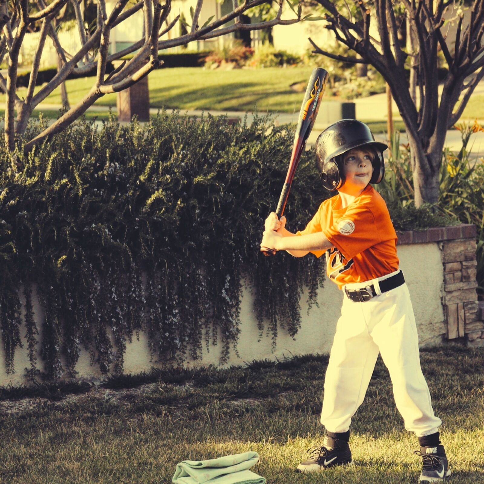 Canon EF 28-135mm F3.5-5.6 IS USM sample photo. Child, holding, bat, during photography