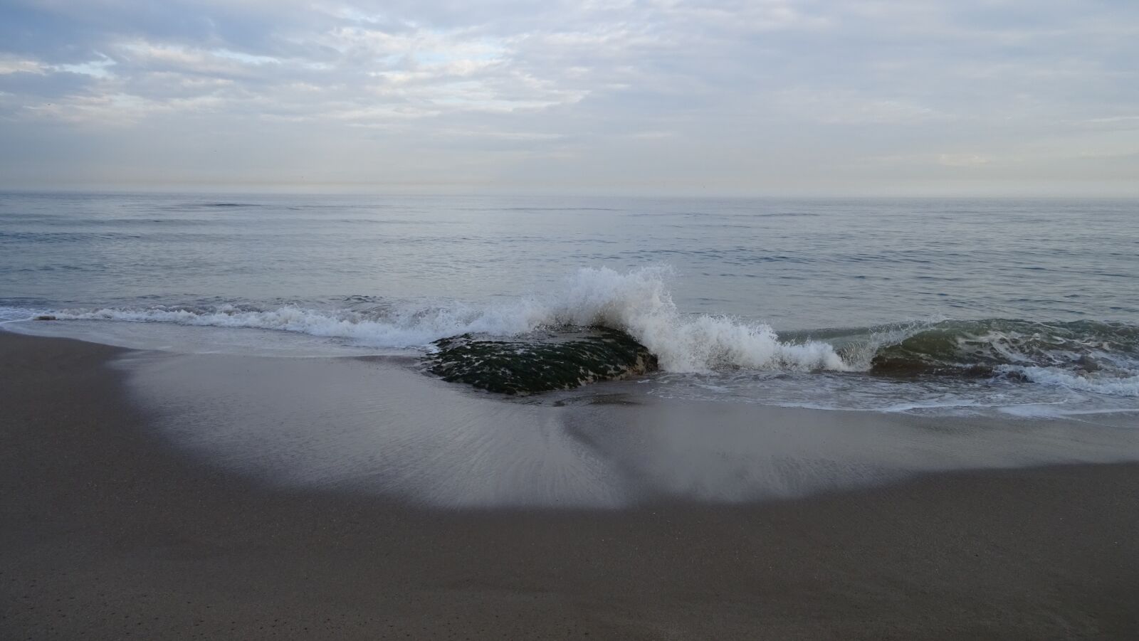 Sony DSC-HX60V sample photo. Sea, rock, beach sand photography