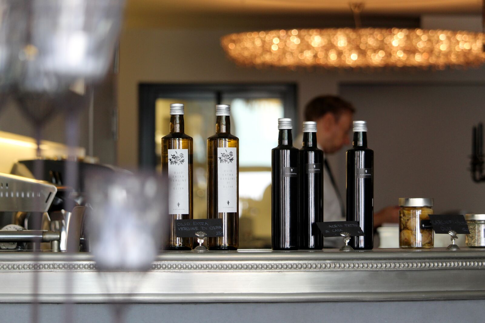 Canon EF-S 55-250mm F4-5.6 IS STM sample photo. Bar, barman, bottles photography