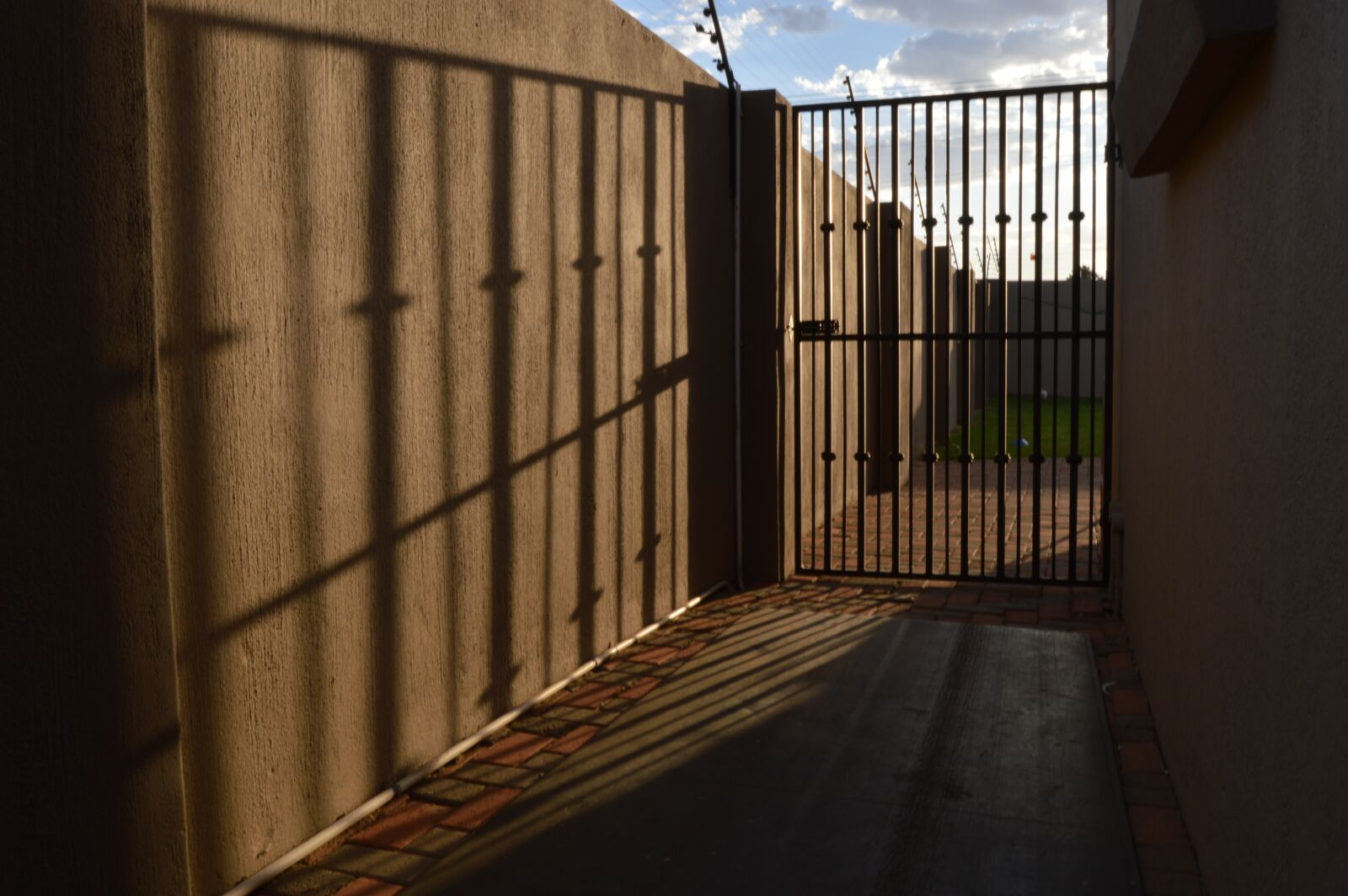 Nikon D3200 sample photo. Gate, wall, shadow photography