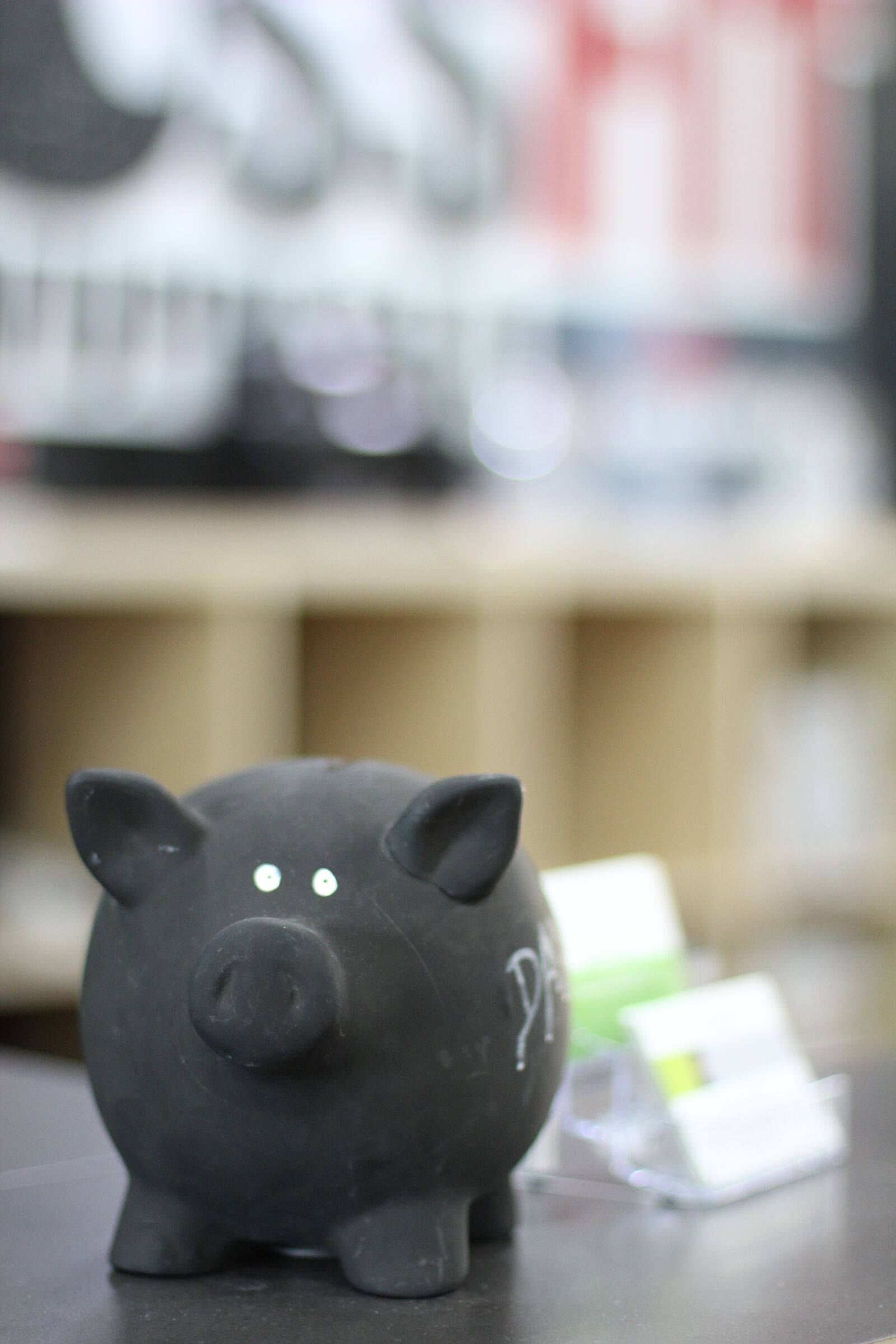 Canon EOS 600D (Rebel EOS T3i / EOS Kiss X5) + Canon EF 50mm F1.4 USM sample photo. Piggy bank, black, save photography