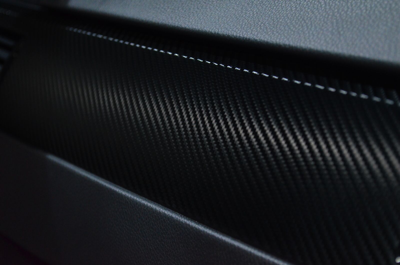 Nikon D5100 sample photo. Carbon, foil, automotive photography