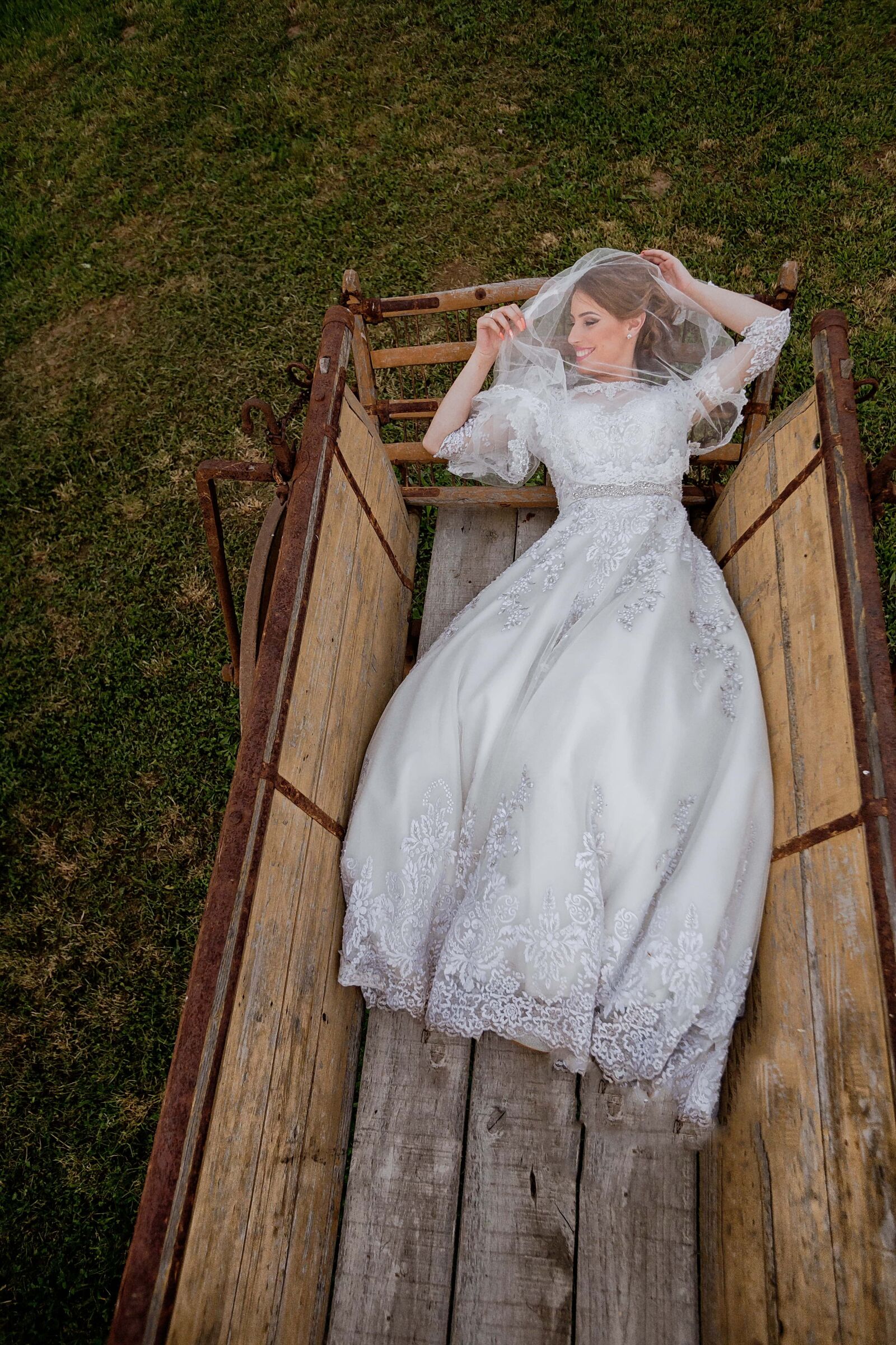 Canon EF 16-35mm F2.8L II USM sample photo. Bride, laying, happiness, carriage photography
