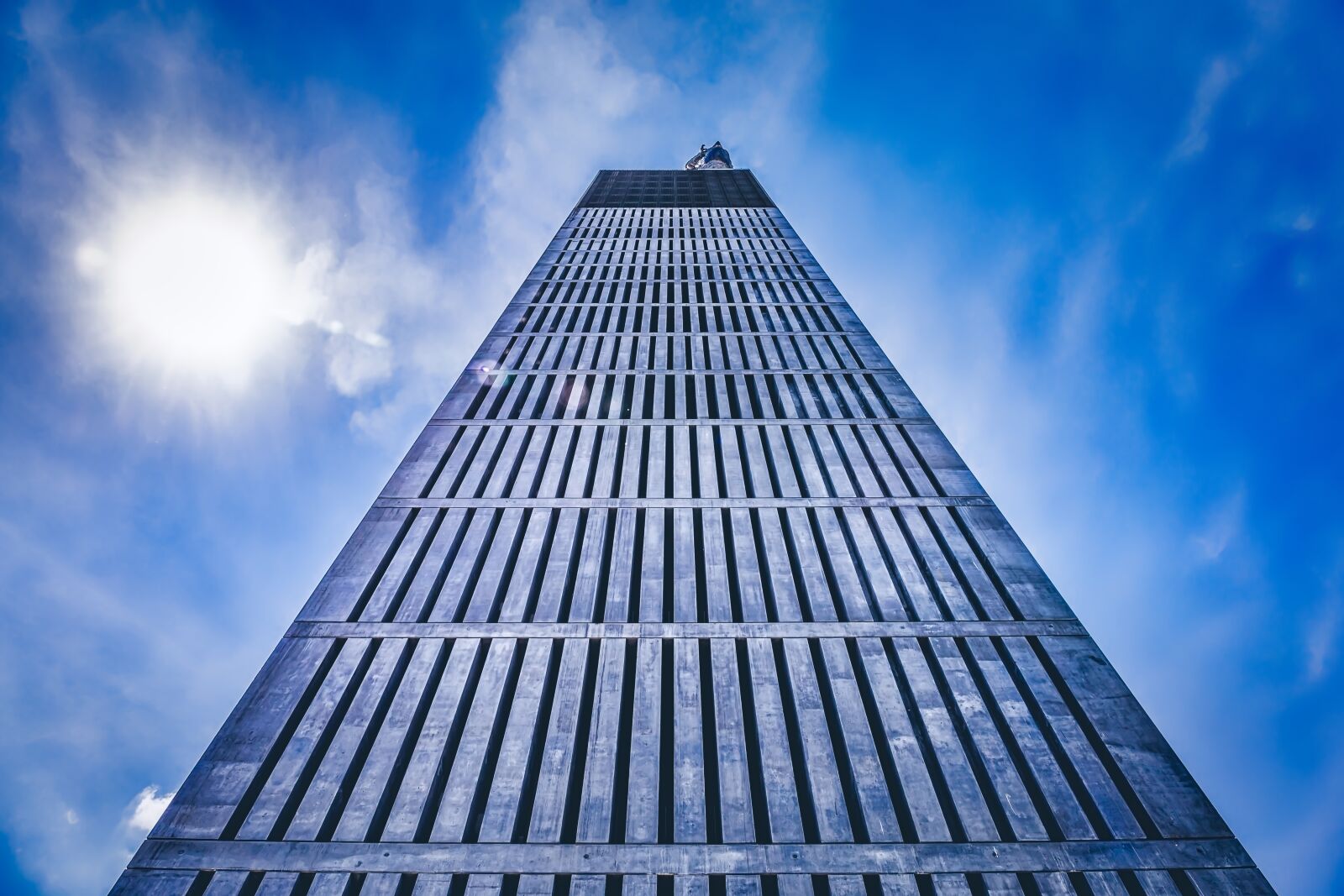 Canon EF 24-70mm F4L IS USM sample photo. Tower, sun, sky photography