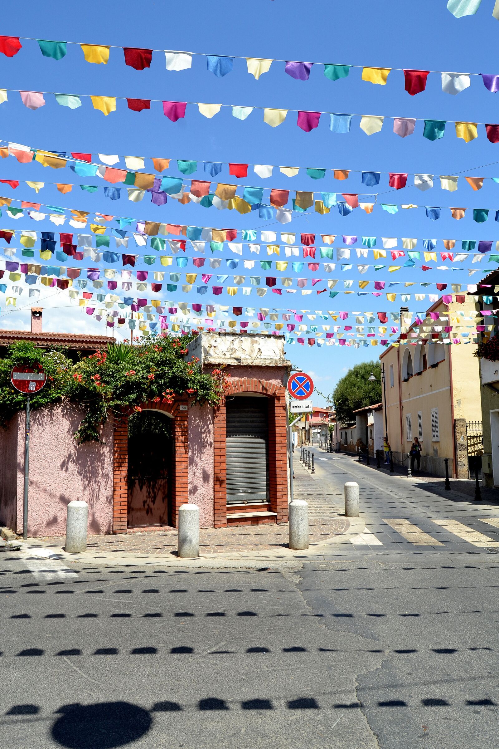 Nikon D3100 sample photo. Pula sardinia, flags, street photography