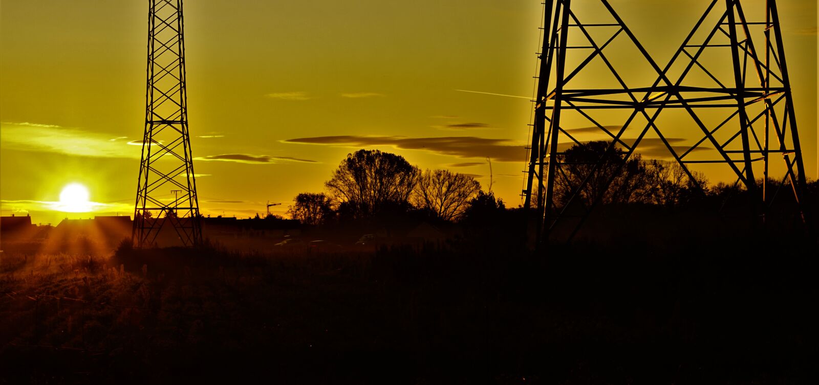Sony FE 50mm F1.8 sample photo. Background, sunrise, pylon photography