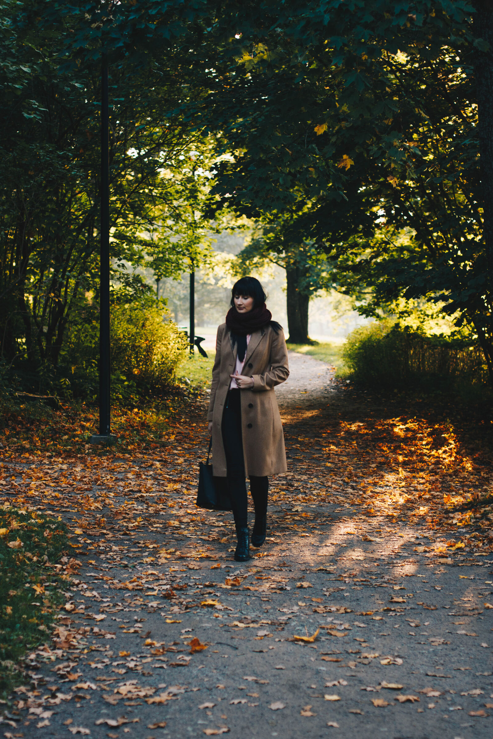 Canon EF 50mm F1.4 USM sample photo. Woman, in, coat, walking photography