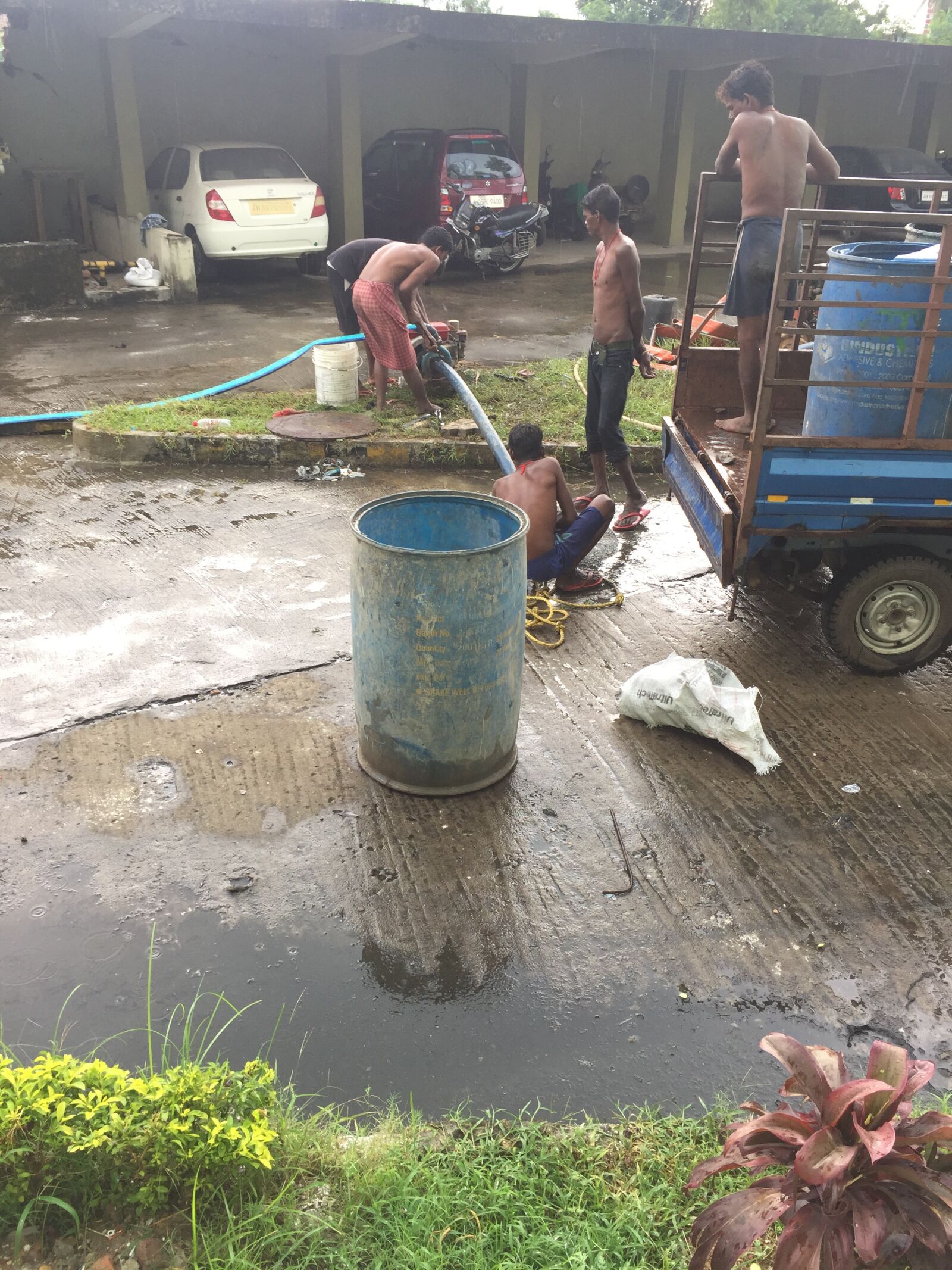 iPhone 6 back camera 4.15mm f/2.2 sample photo. Drains, rains, men photography