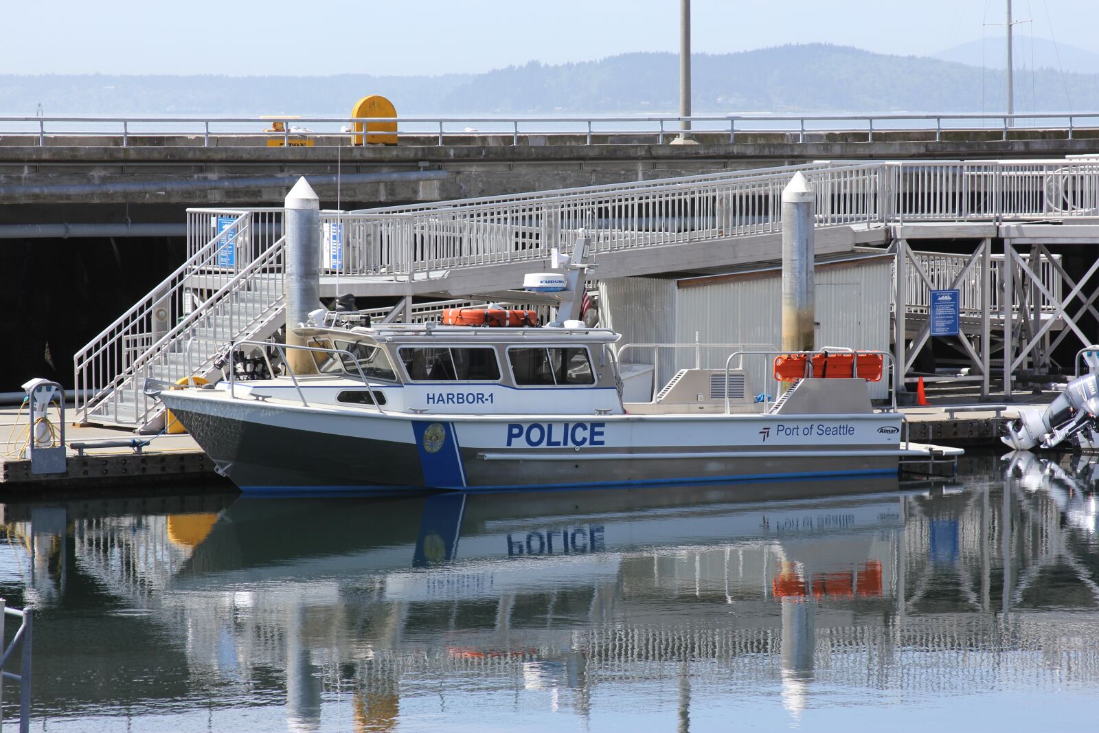 Canon EOS 60D + Canon EF 28-135mm F3.5-5.6 IS USM sample photo. Police, boat, emergency photography